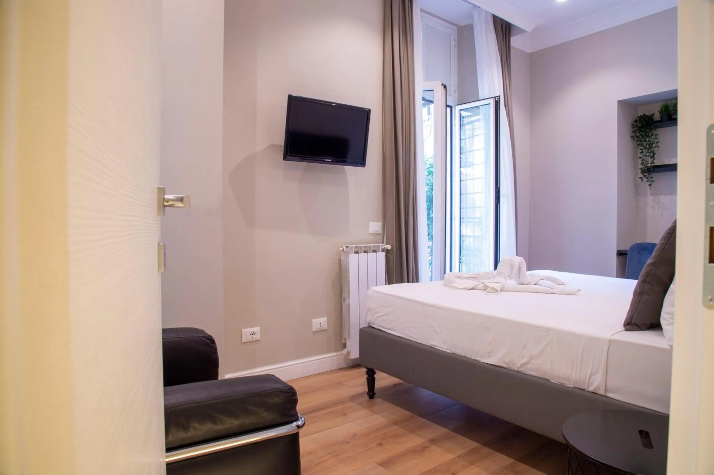 Bed in AD Suites Tritone