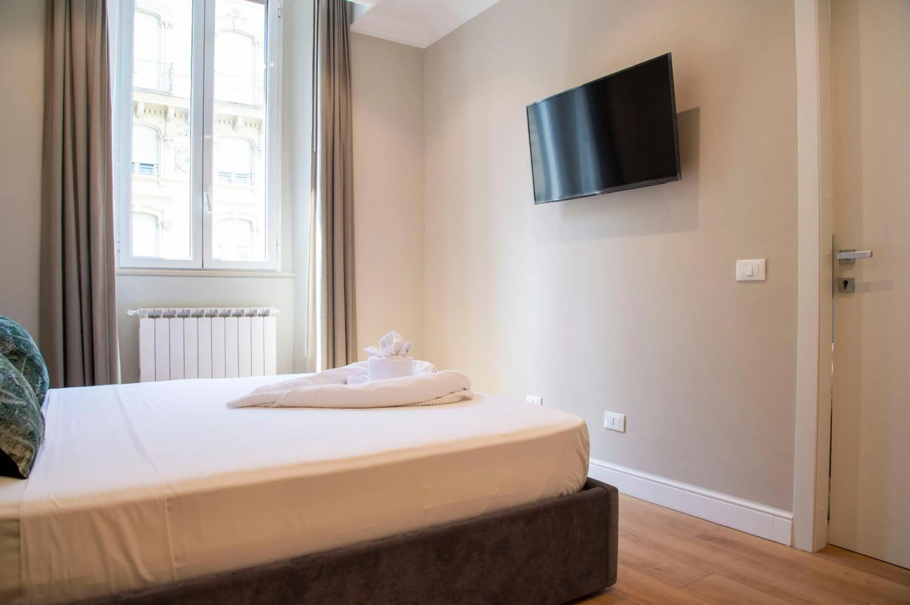 Bed in AD Suites Tritone