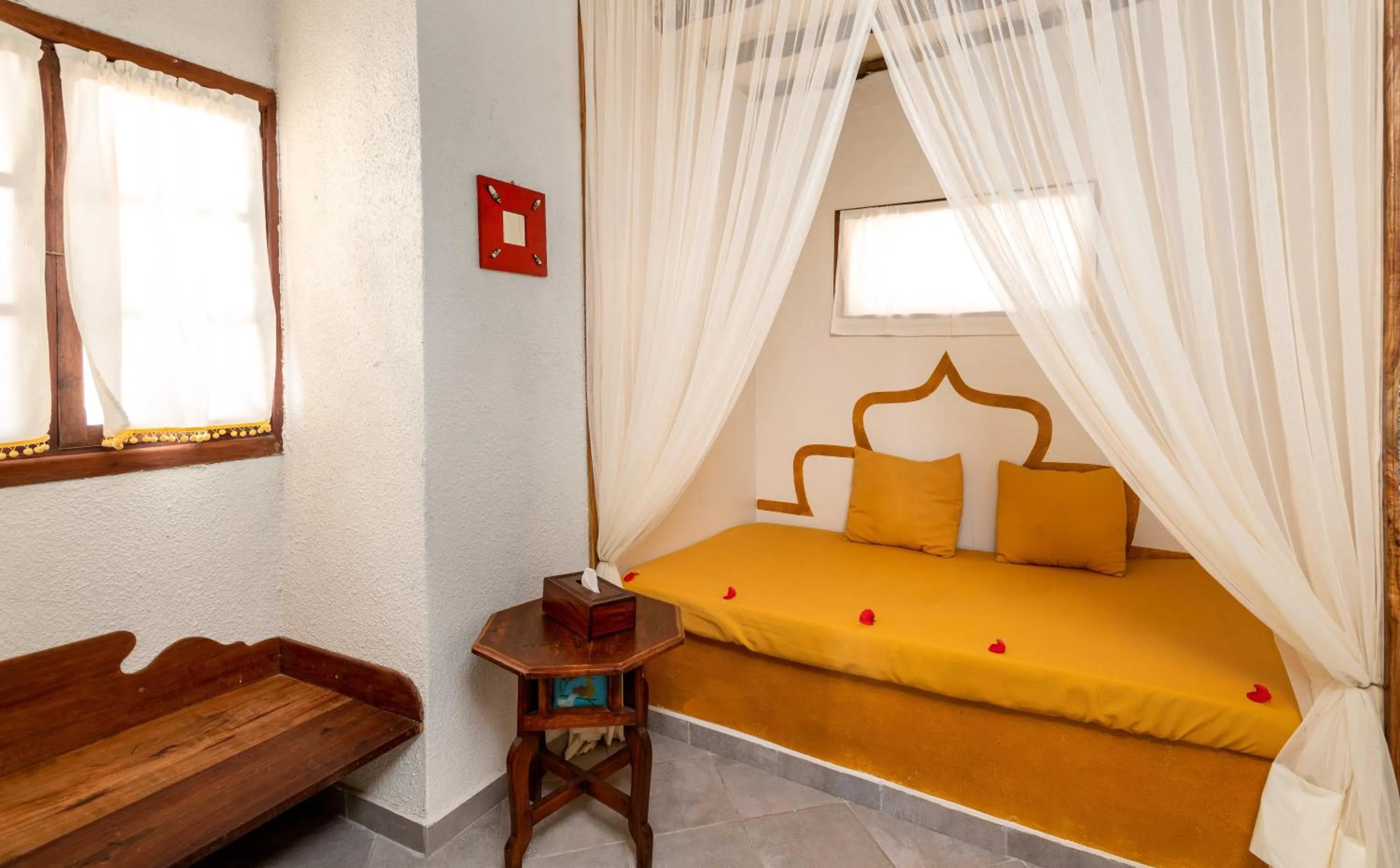 Bed in Karafuu Beach Resort & Spa