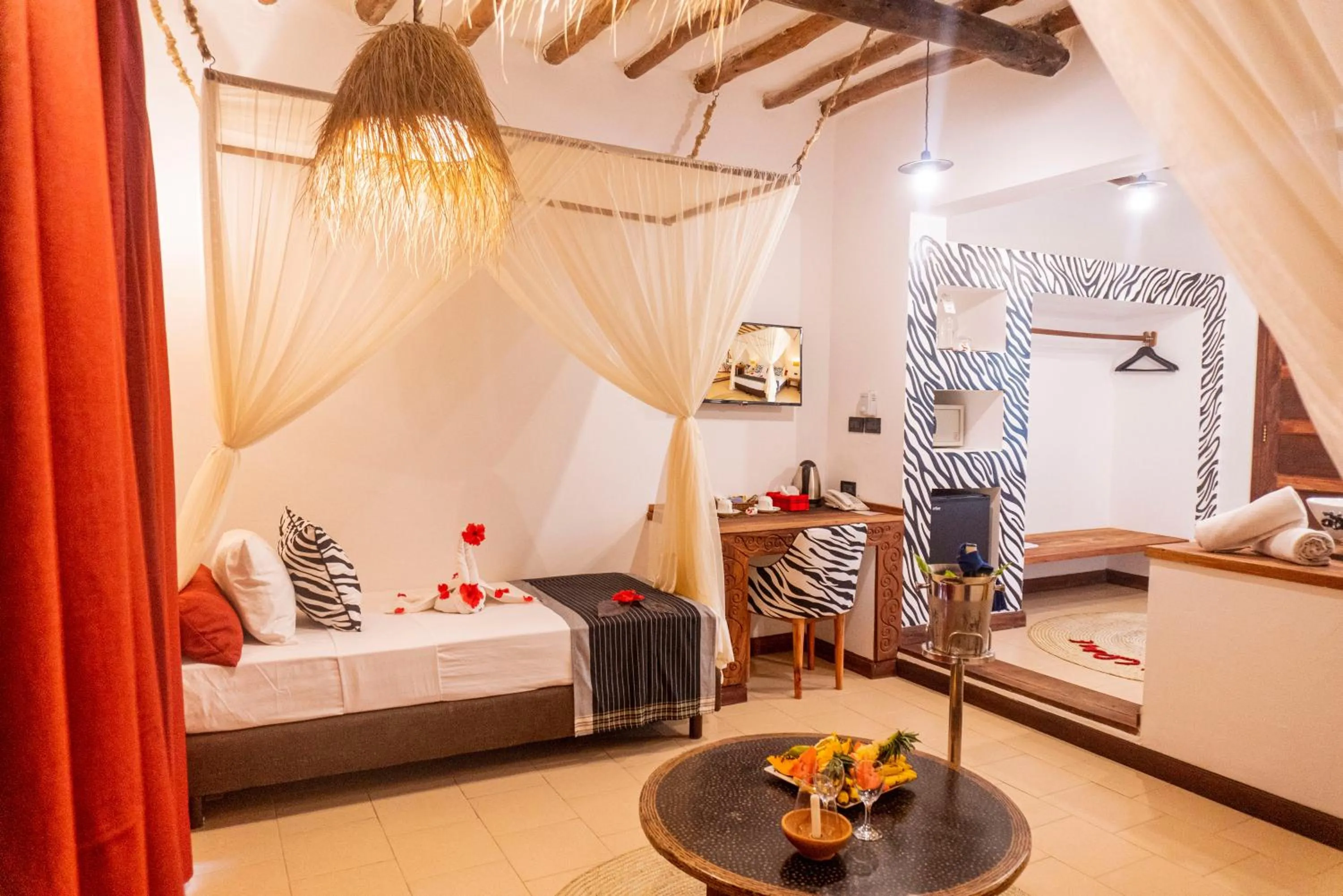 Bed in Karafuu Beach Resort & Spa