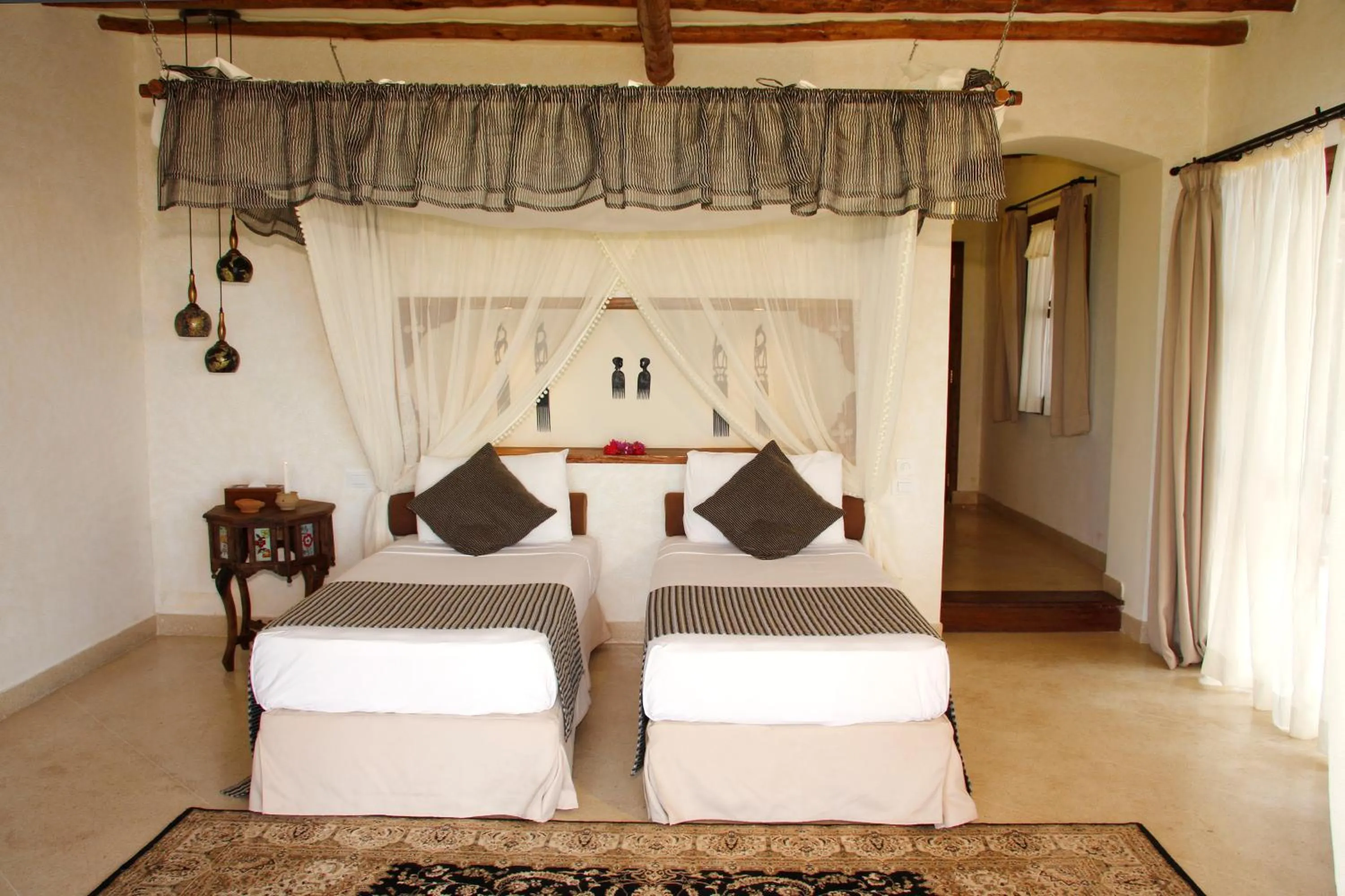 Bed in Karafuu Beach Resort & Spa