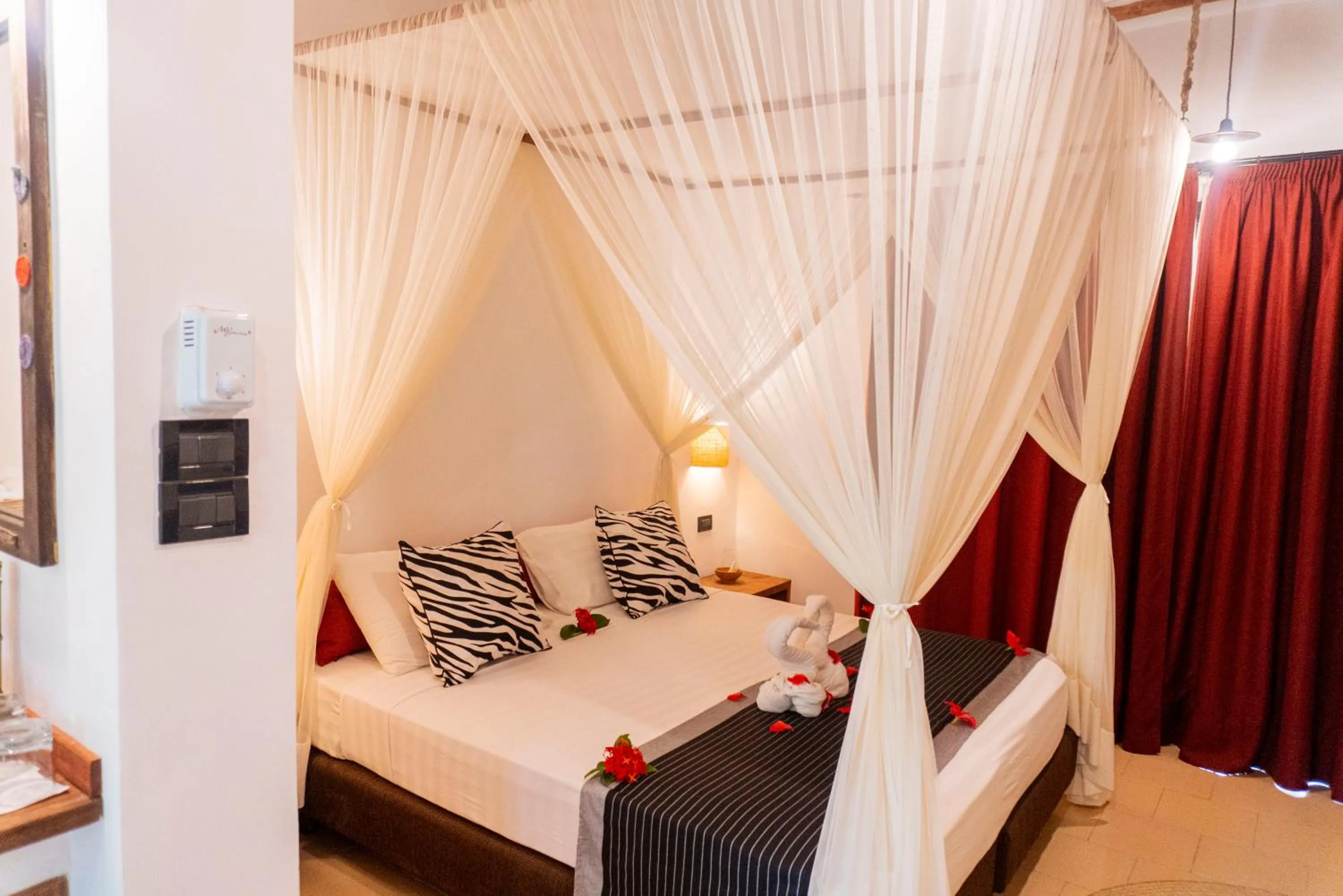 Bed in Karafuu Beach Resort & Spa