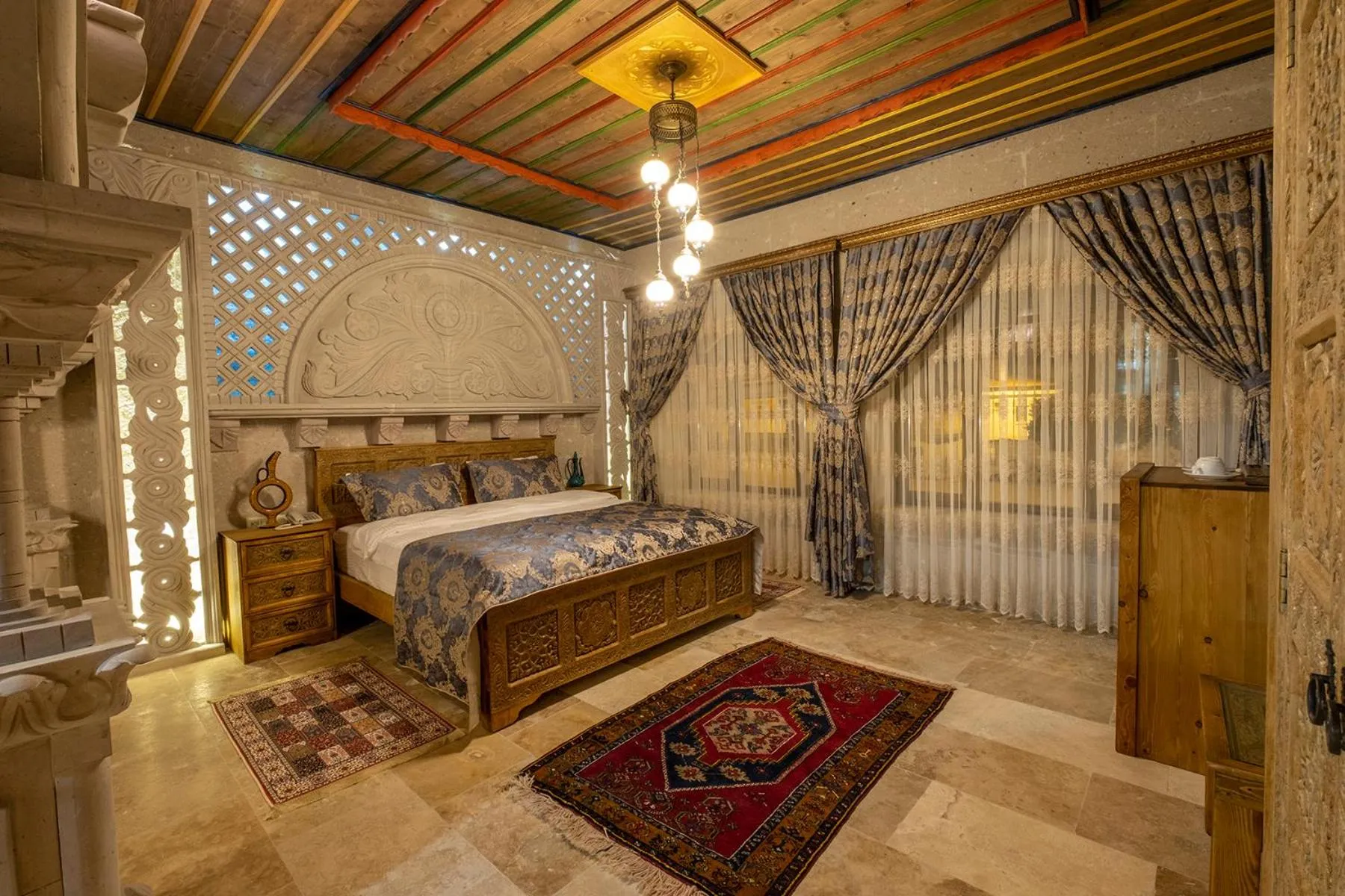 Photo of the whole room, Bed in Underground Cave Suites Hotel