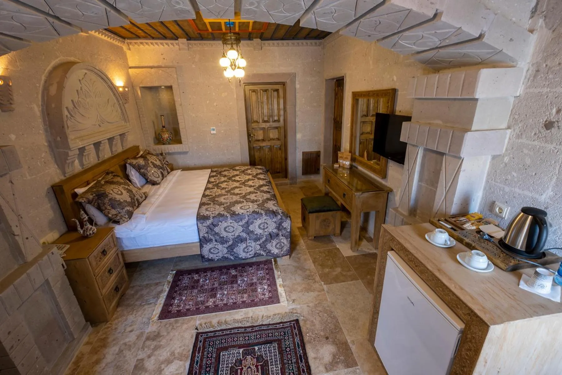 Bed in Underground Cave Suites Hotel