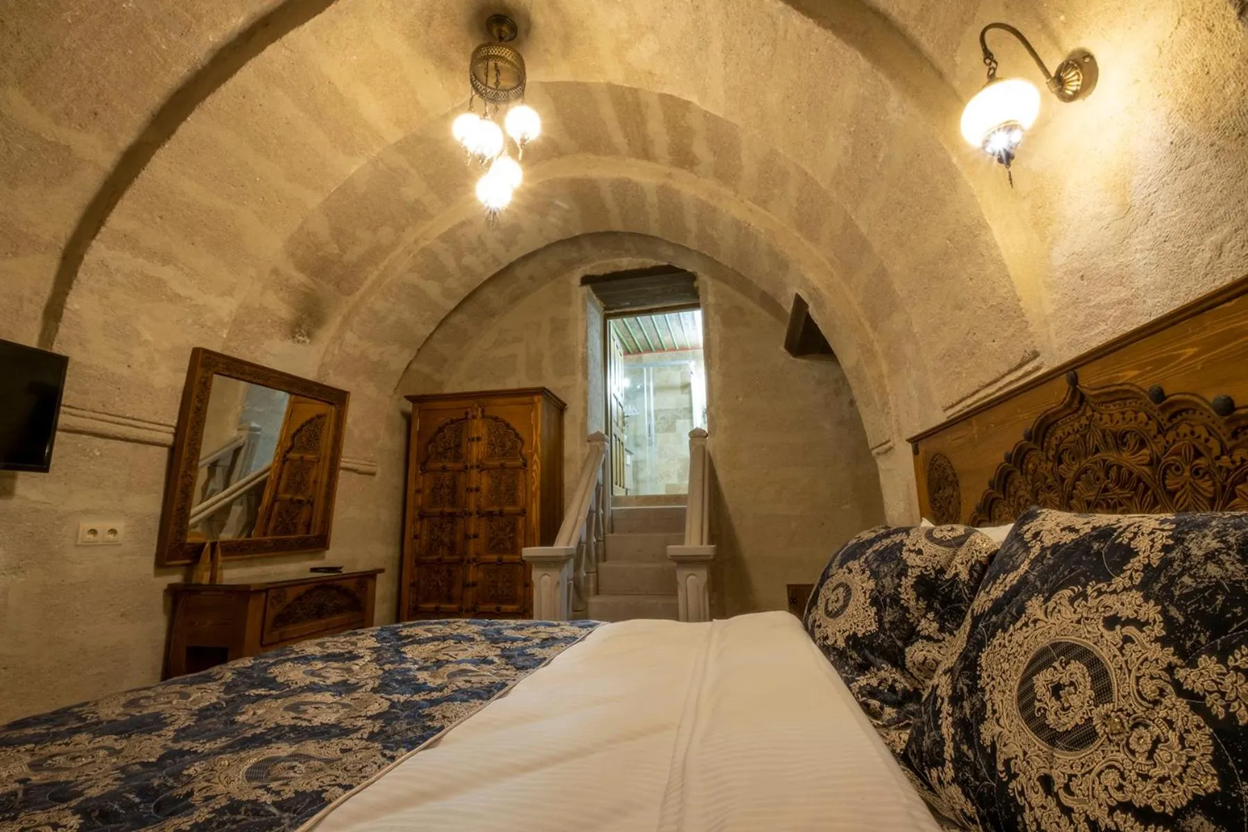 Bed in Underground Cave Suites Hotel