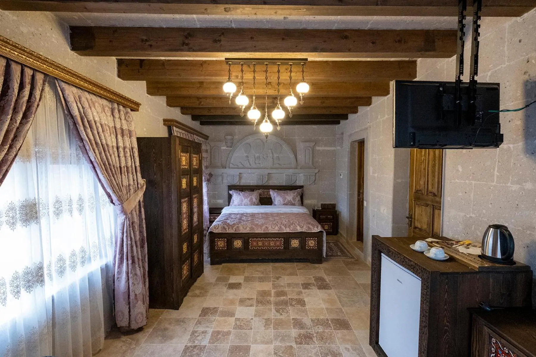 Photo of the whole room, Bed in Underground Cave Suites Hotel