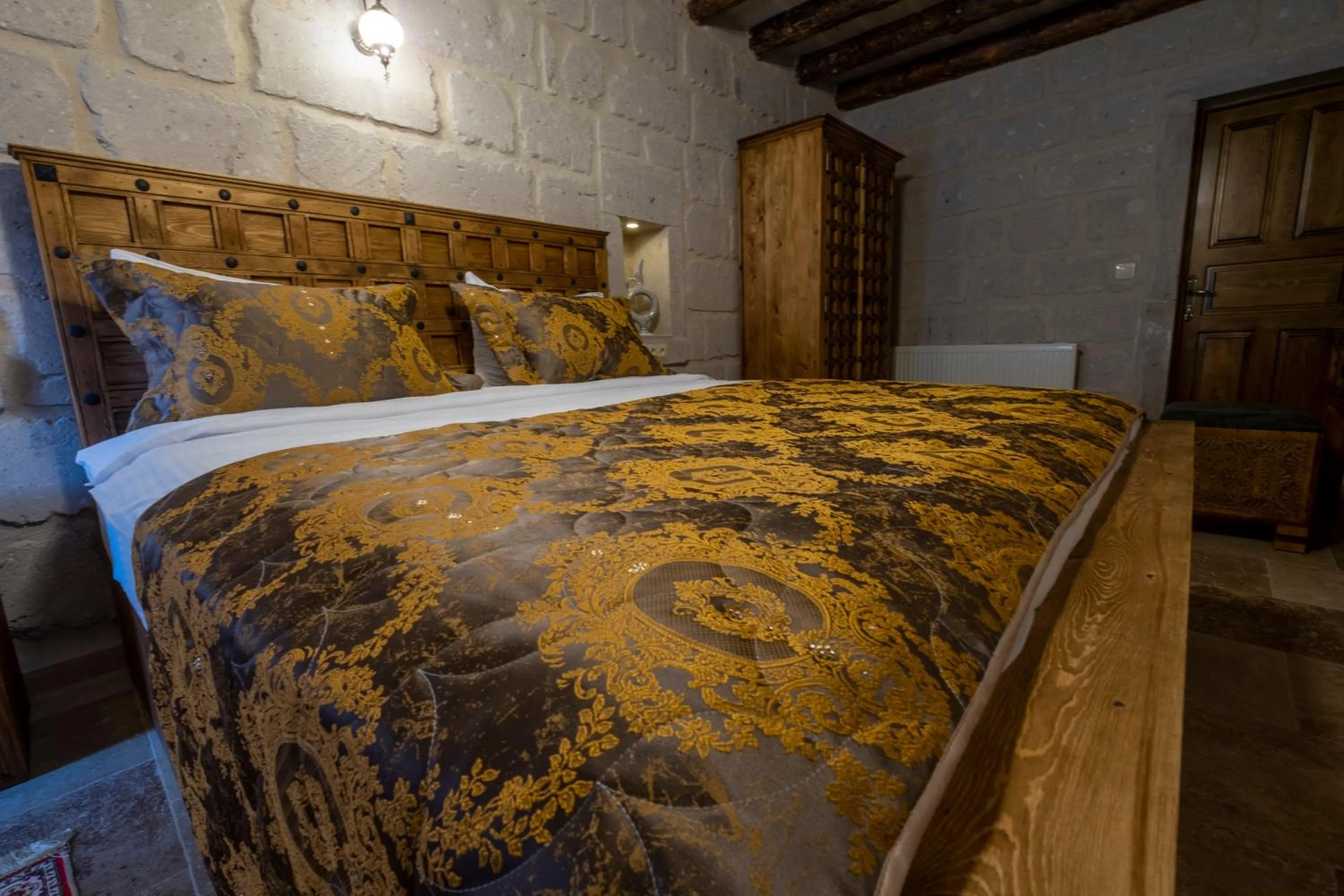 Bed in Underground Cave Suites Hotel