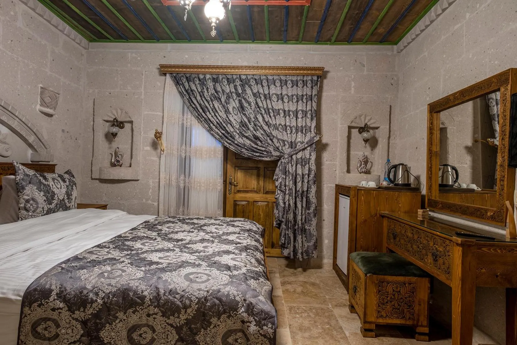 Bed in Underground Cave Suites Hotel