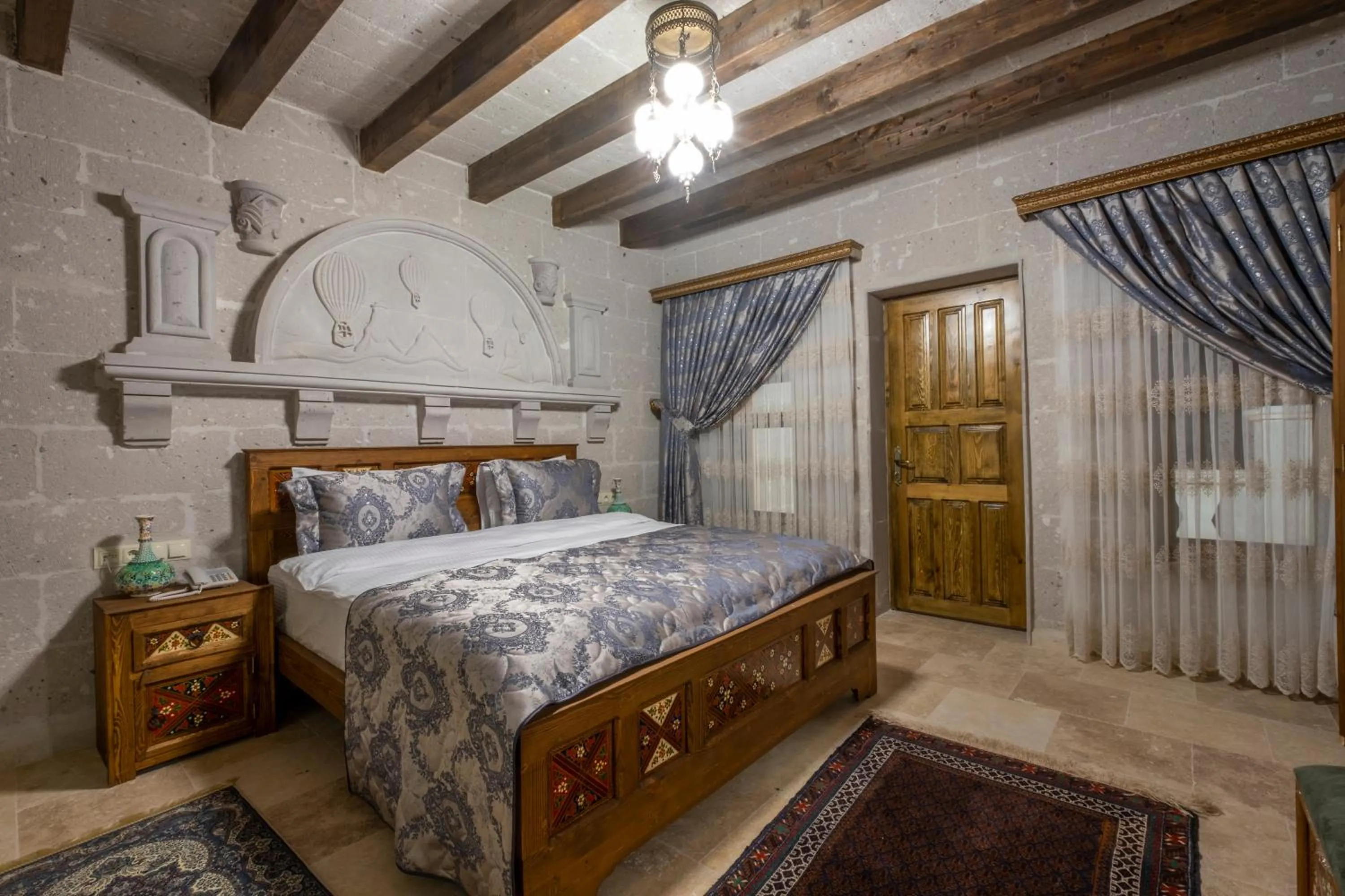 Bedroom, Bed in Underground Cave Suites Hotel