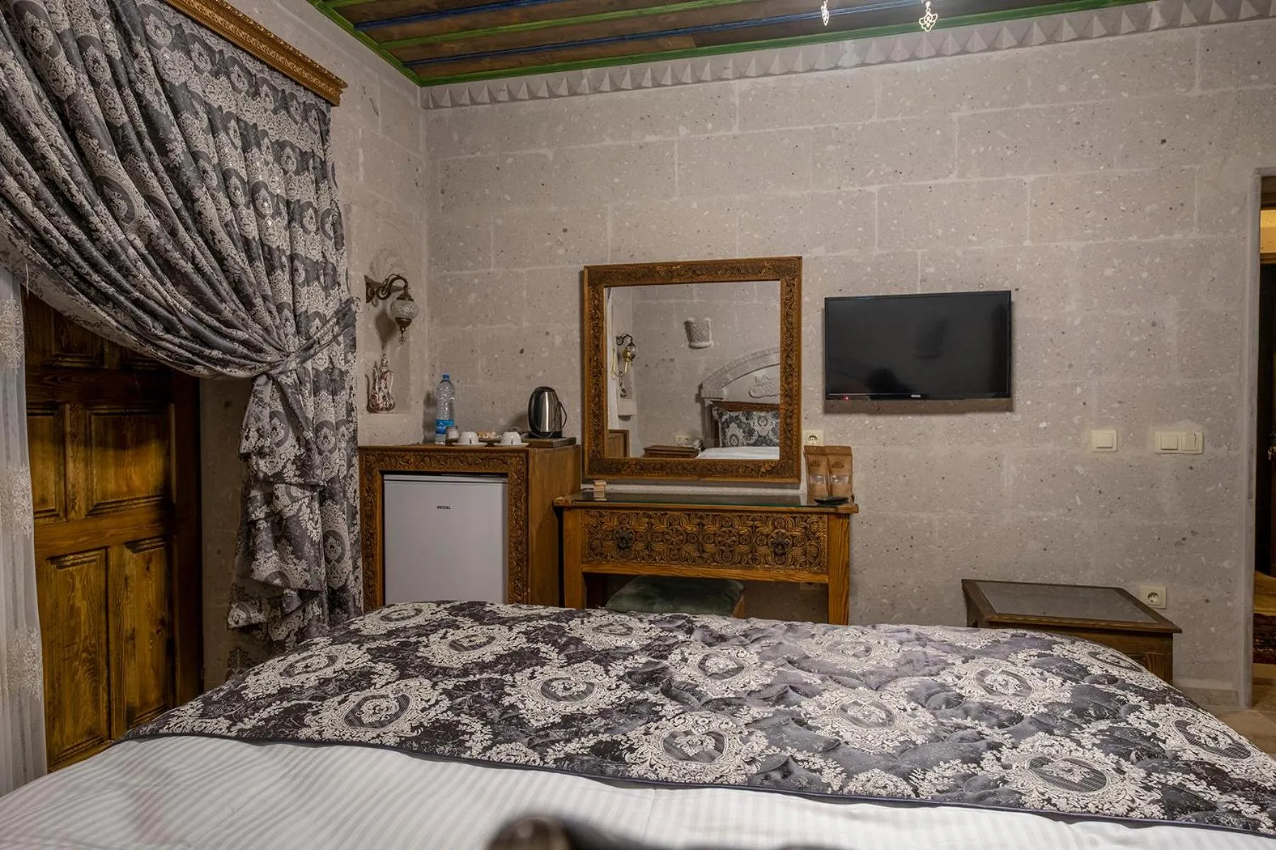 Bed in Underground Cave Suites Hotel