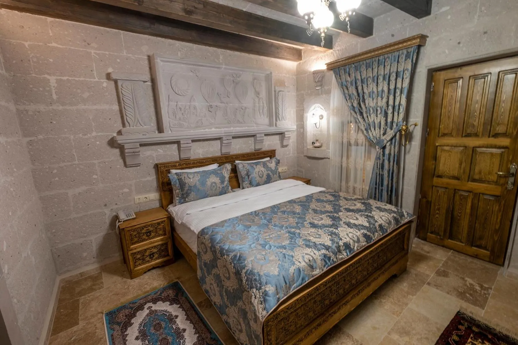 Photo of the whole room, Bed in Underground Cave Suites Hotel