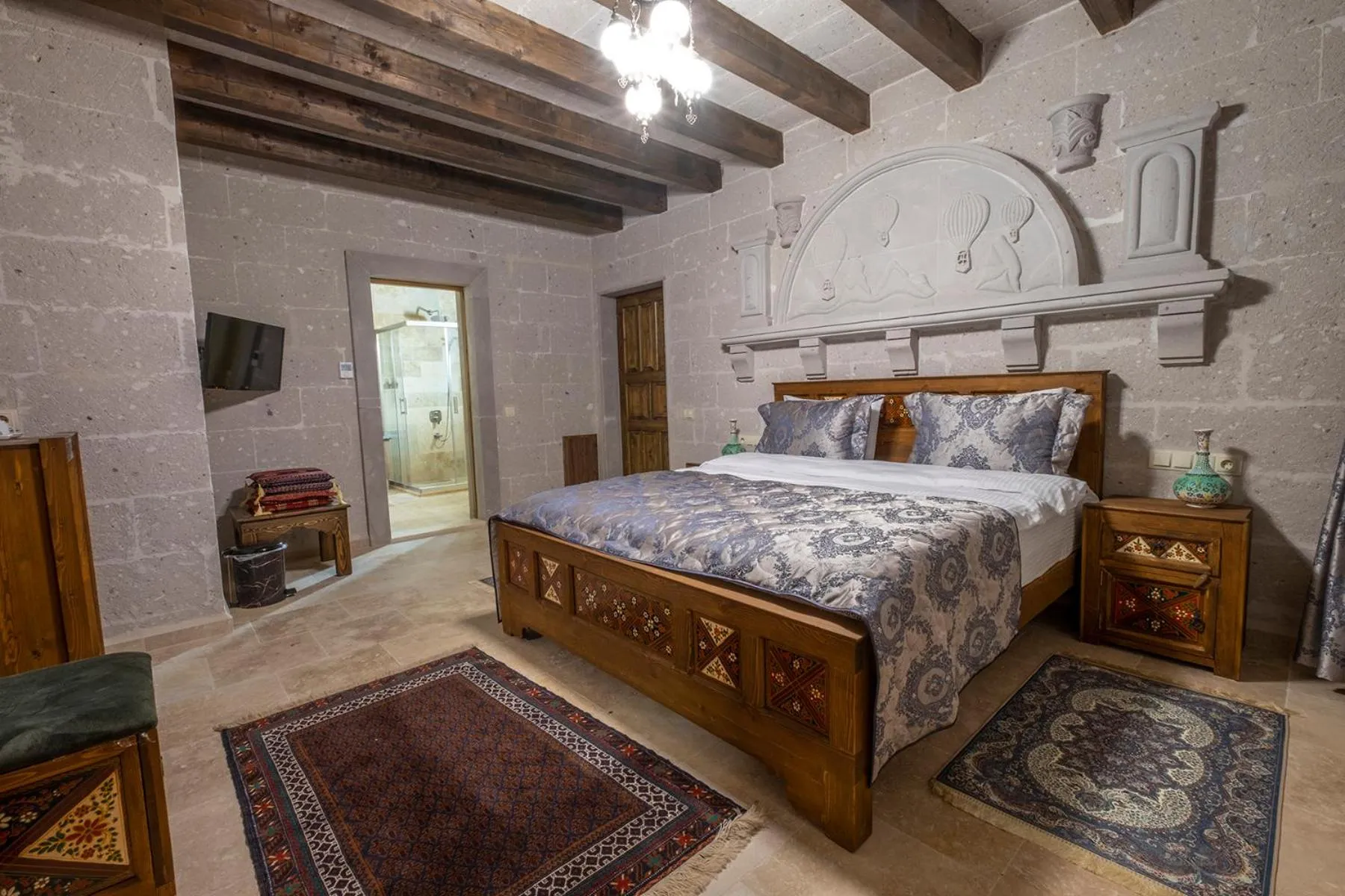 Shower, Bed in Underground Cave Suites Hotel