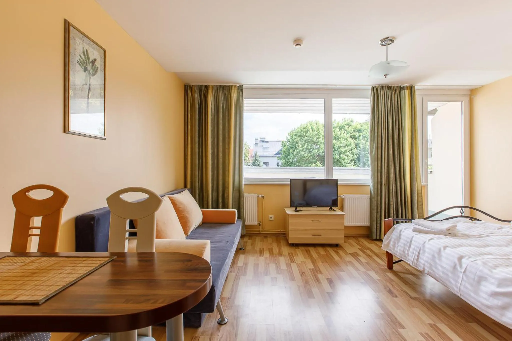 Seating area, Bed in Viešbutis Prie Fontano