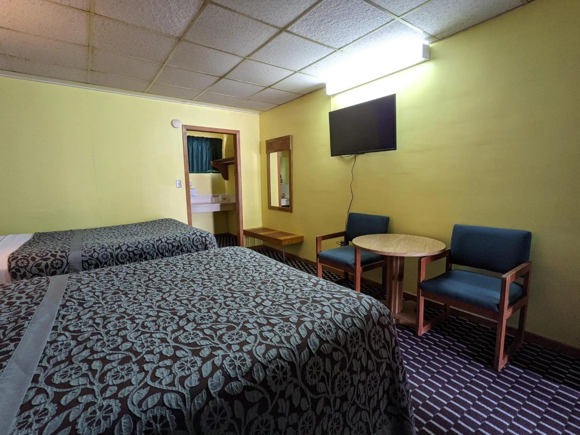 Bed in Great Plains Budget Inn