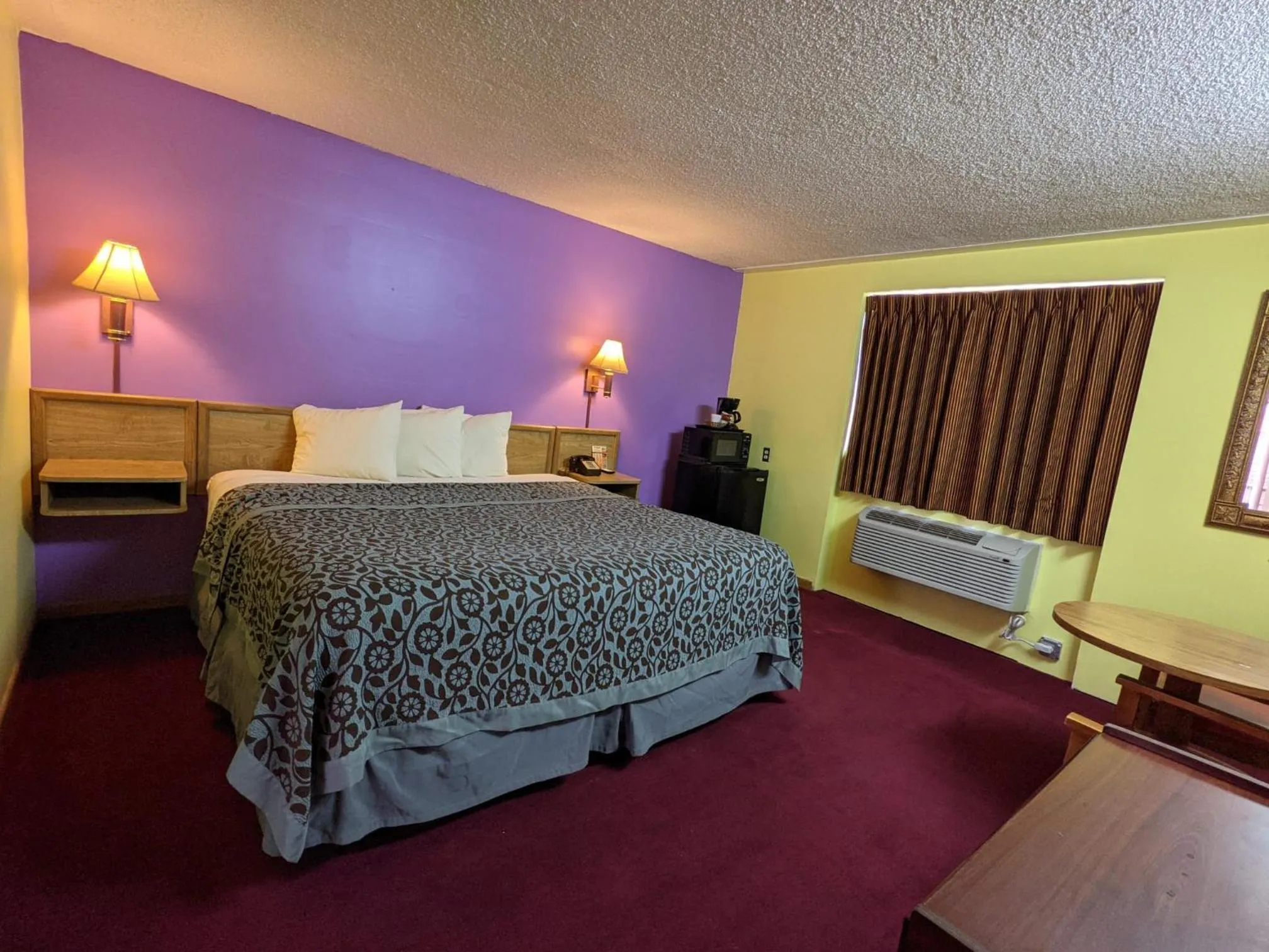 Bed in Great Plains Budget Inn