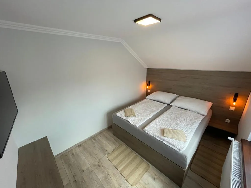 Bed in Kukorica Csárda Apartman