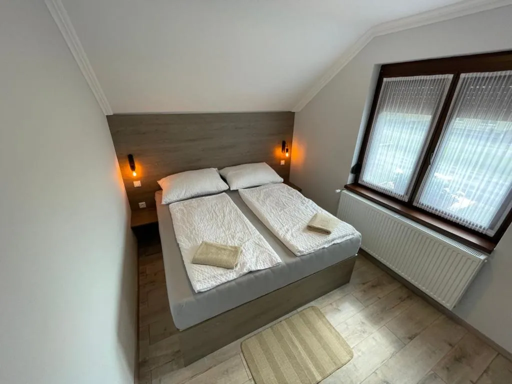 Bed in Kukorica Csárda Apartman