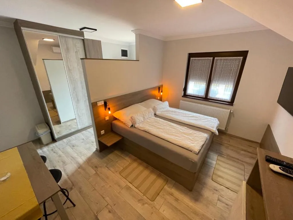 Bed in Kukorica Csárda Apartman