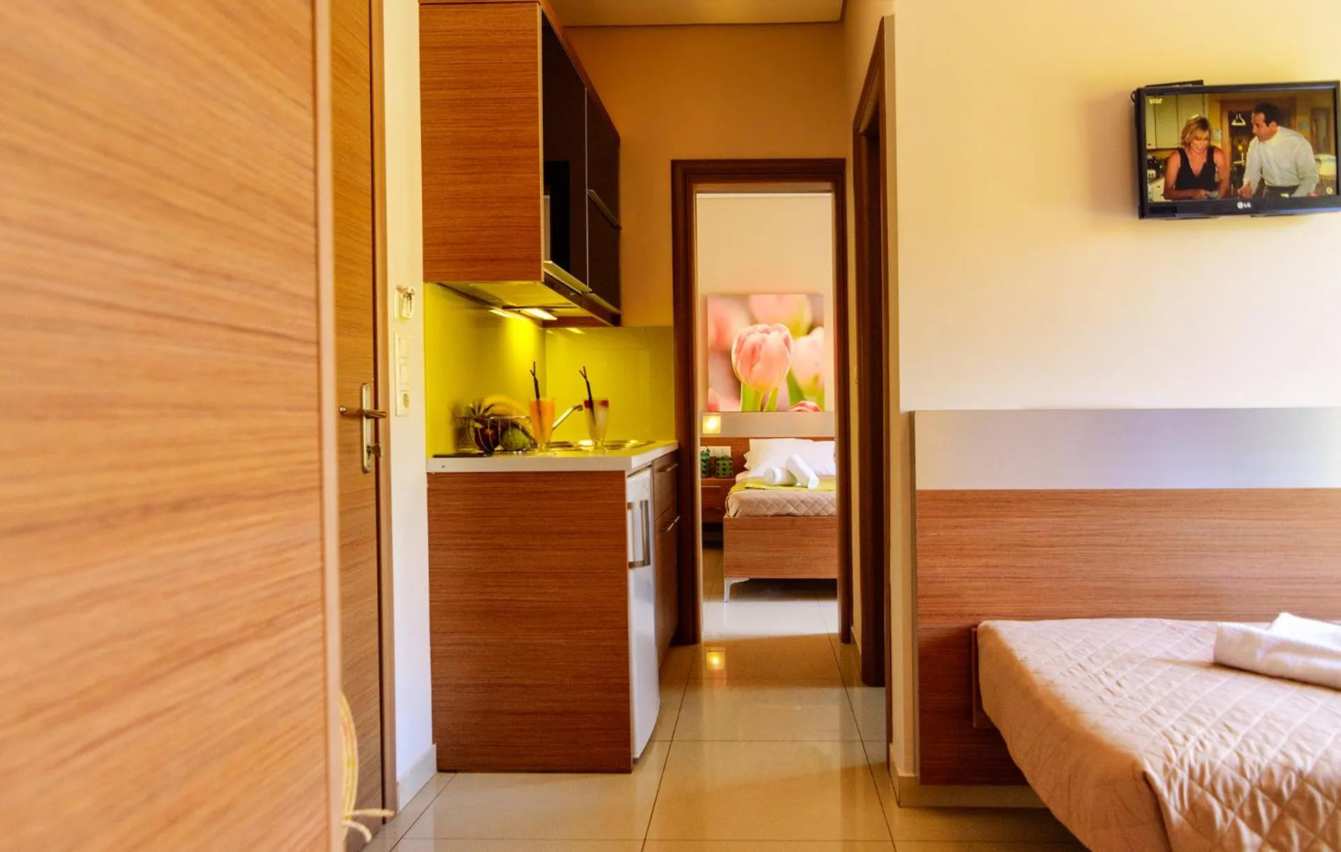 Kitchen or kitchenette, Bed in Relax Hotel