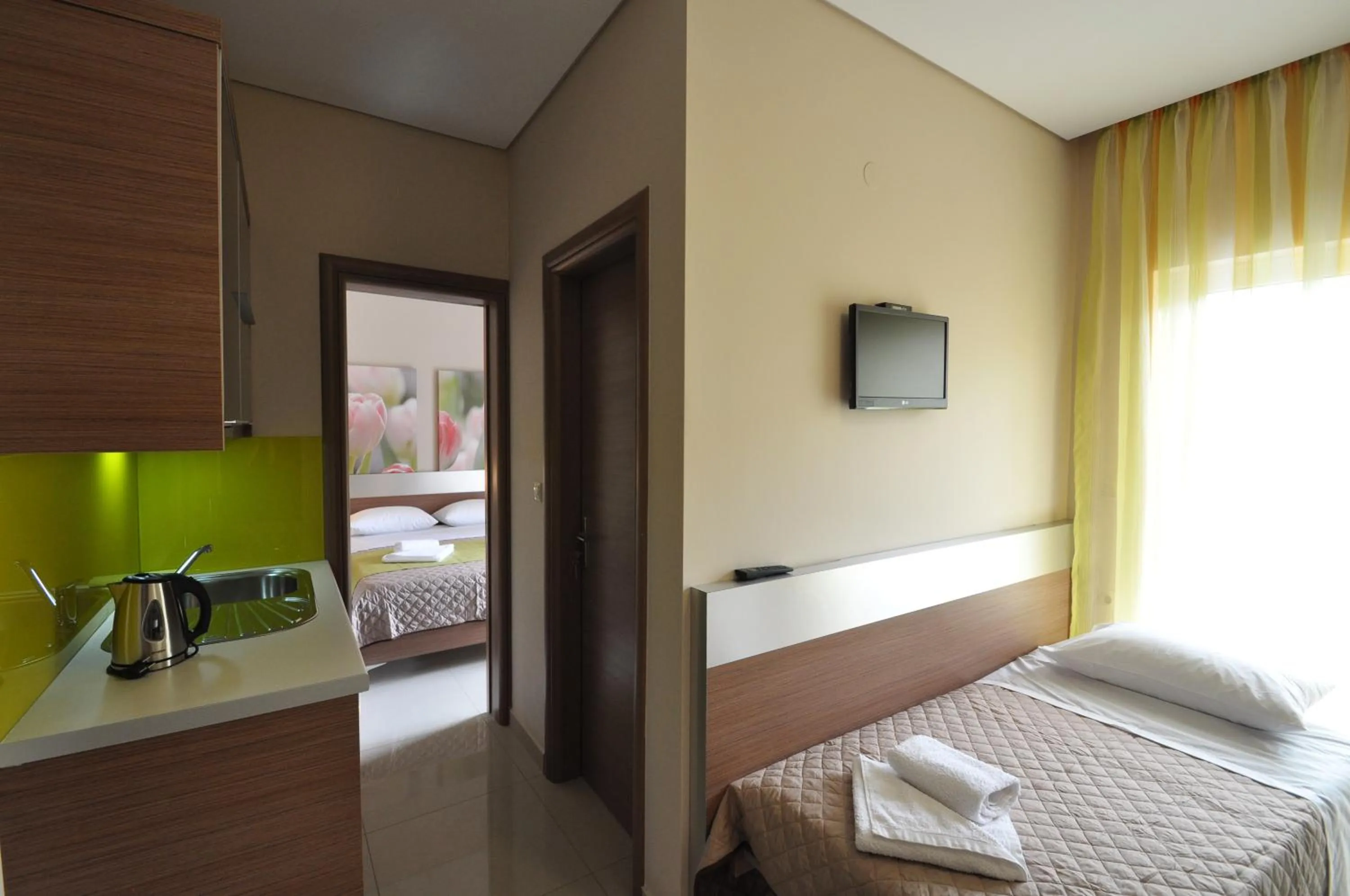 Kitchen or kitchenette, Bed in Relax Hotel