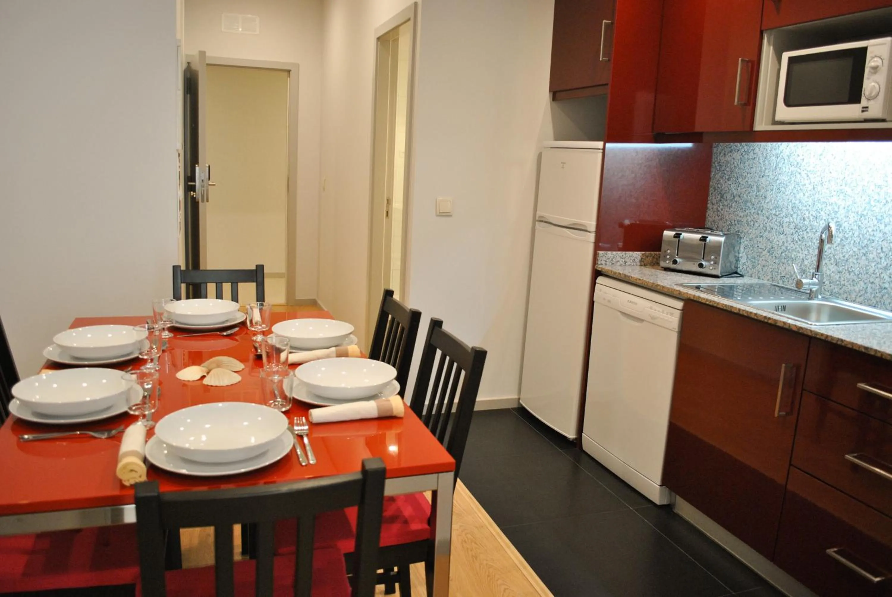 Kitchen or kitchenette in Apartamentos Portodouro - Santa Catarina
