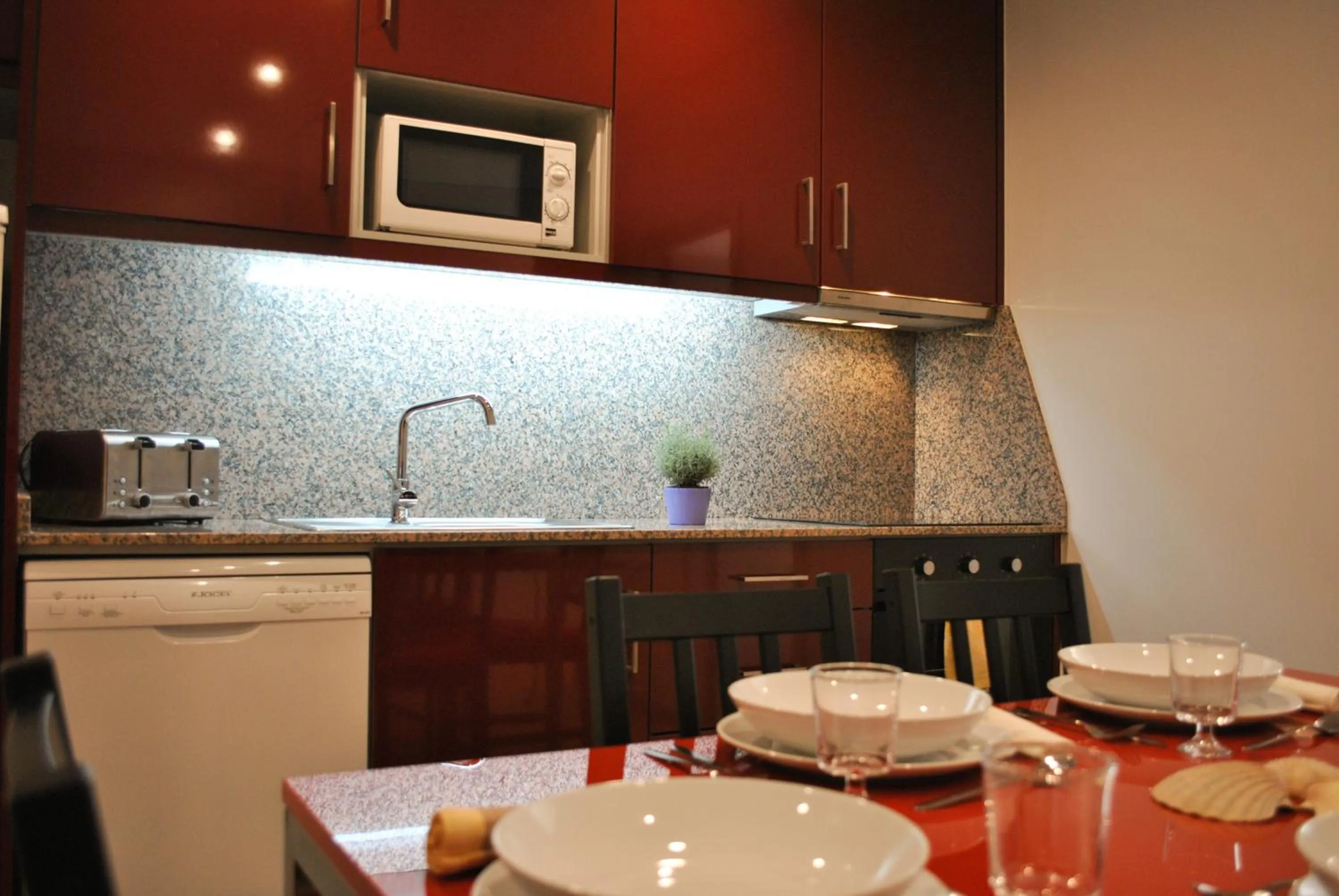 Kitchen or kitchenette in Apartamentos Portodouro - Santa Catarina