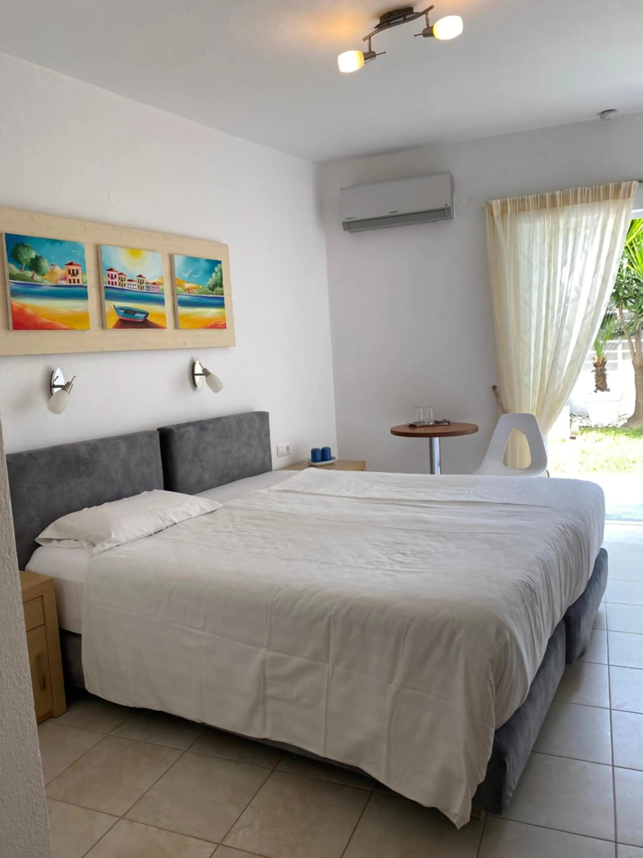 Bed in Anemoni Beach Hotel