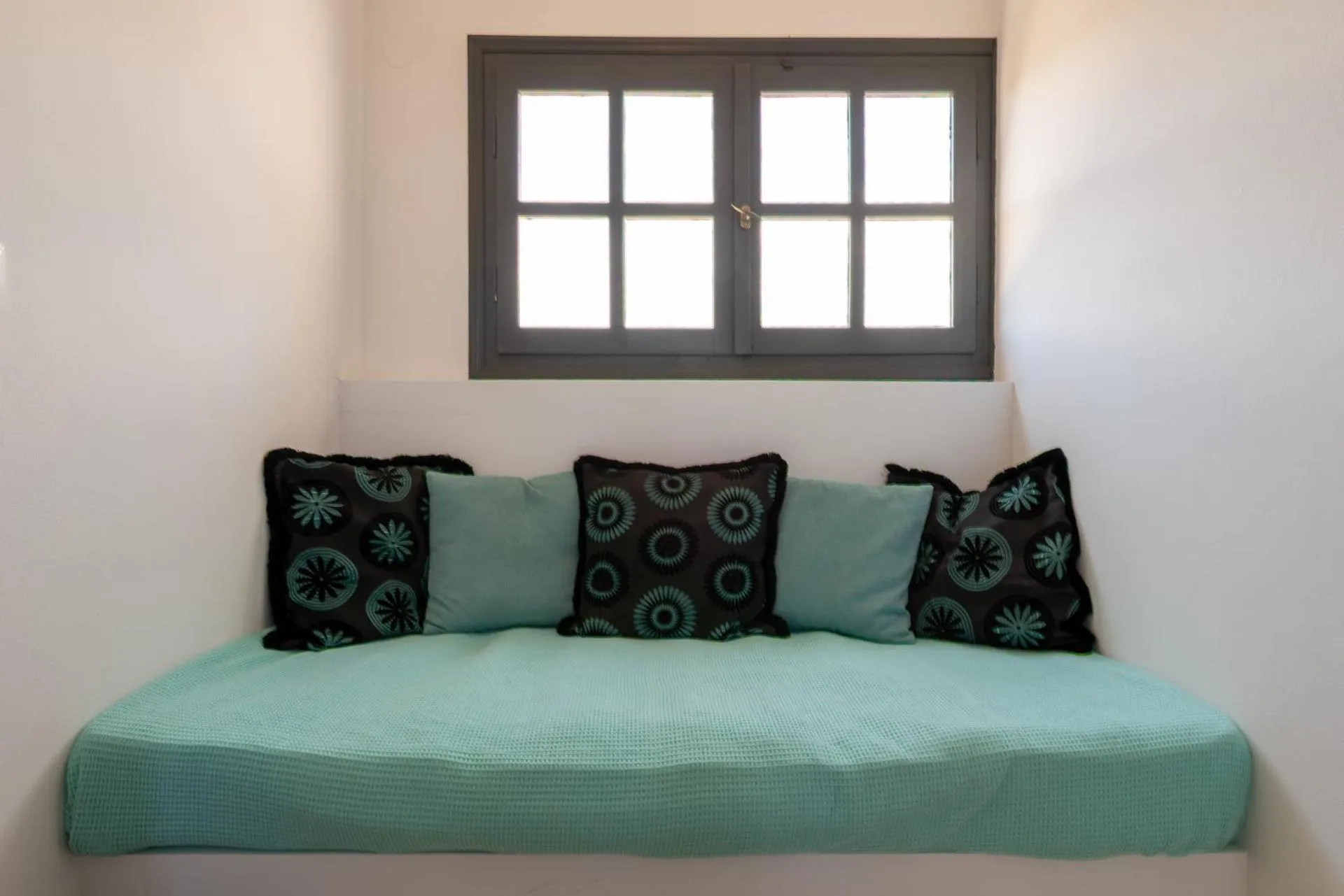 Bed in Anemos Inn by Estia