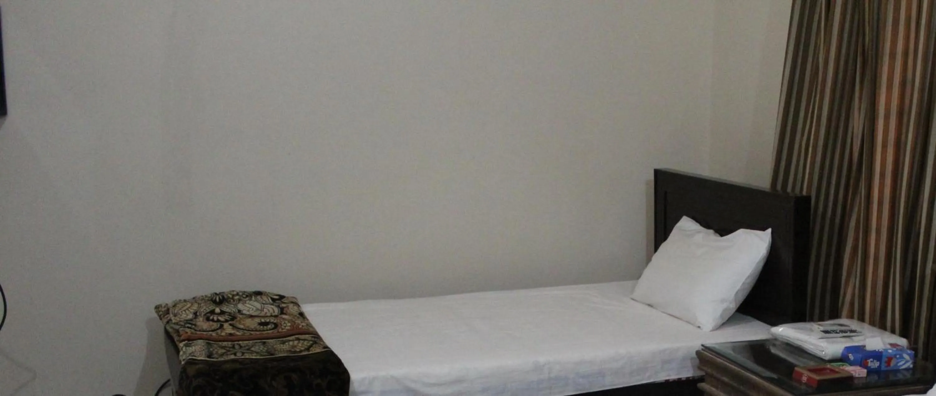 Bed in HOTEL STATE RESIDENCY