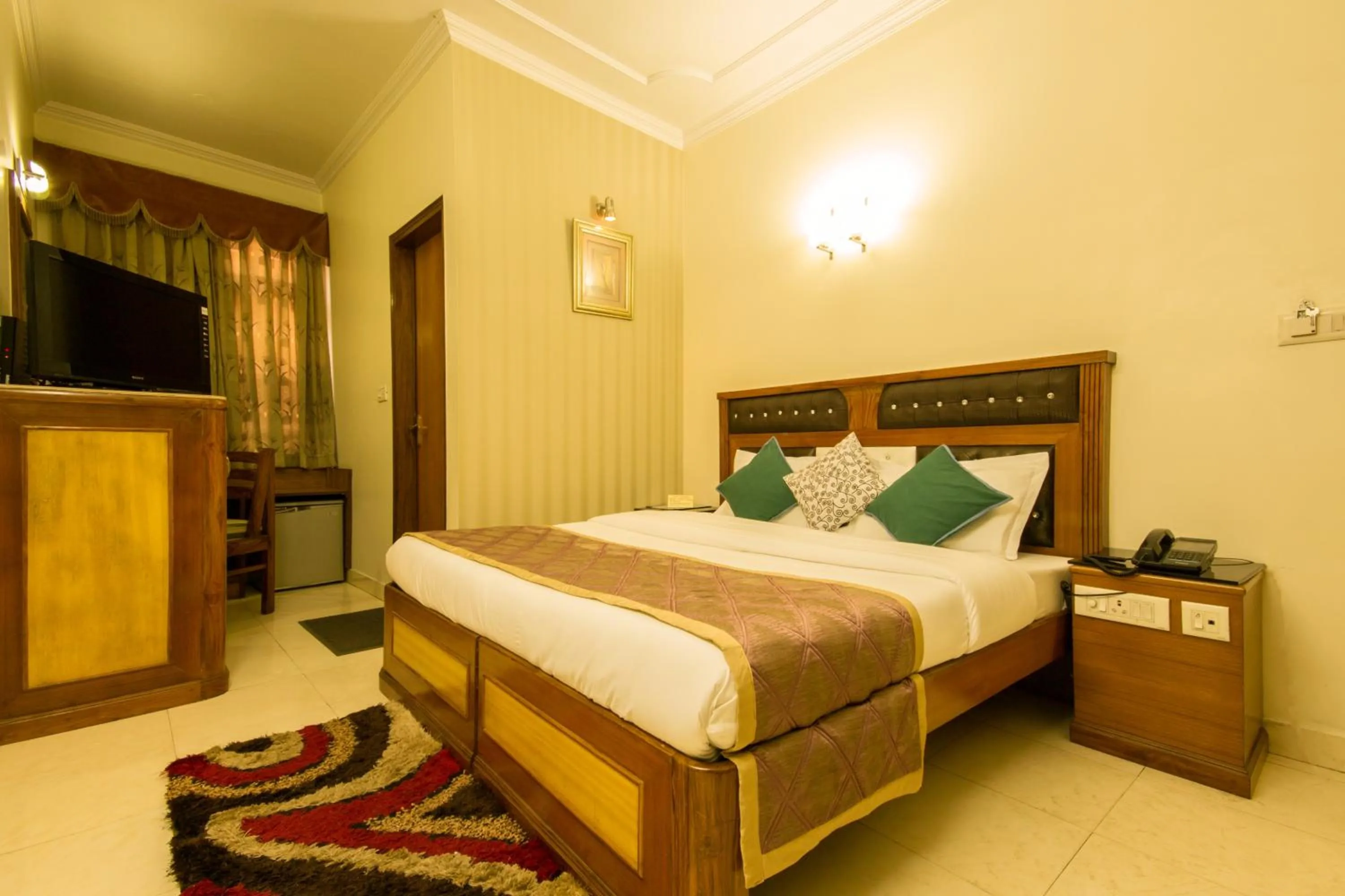 Photo of the whole room, Bed in The C Park Inn Karol Bagh Homely Atmosphere