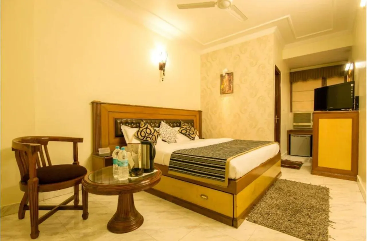 Bed in The C Park Inn Karol Bagh Homely Atmosphere