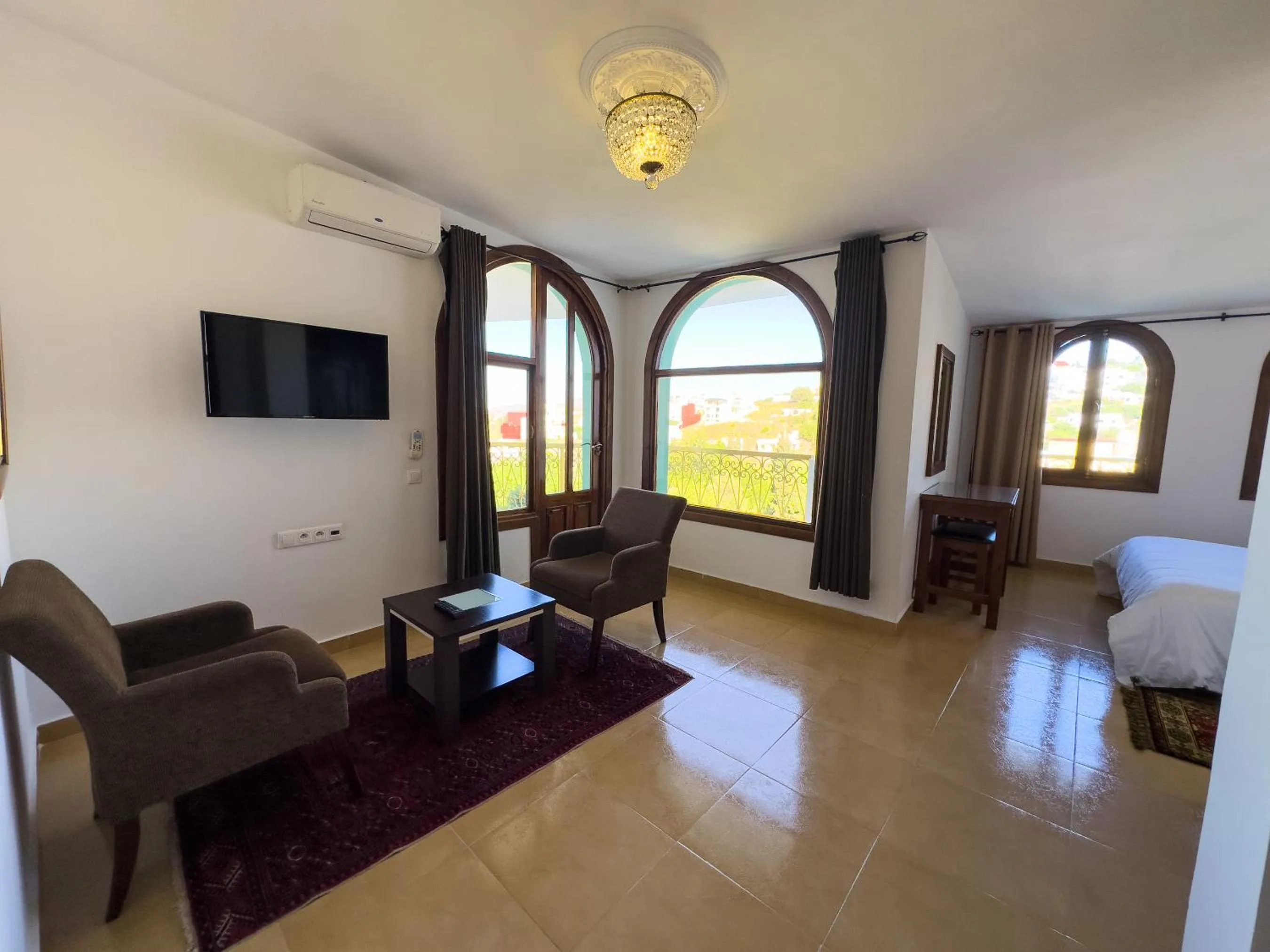 Seating area, Bed in Riad Dar Achaach