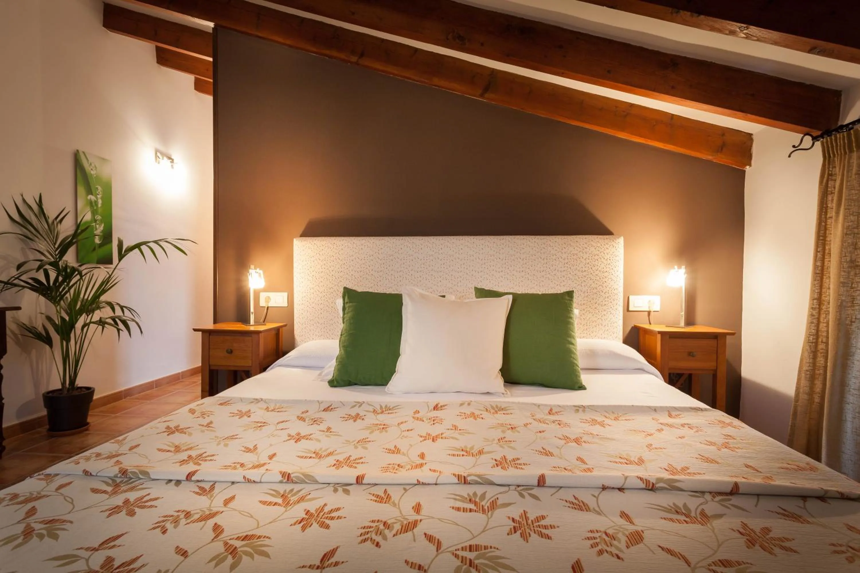 Bed in Petit Hotel Alaro