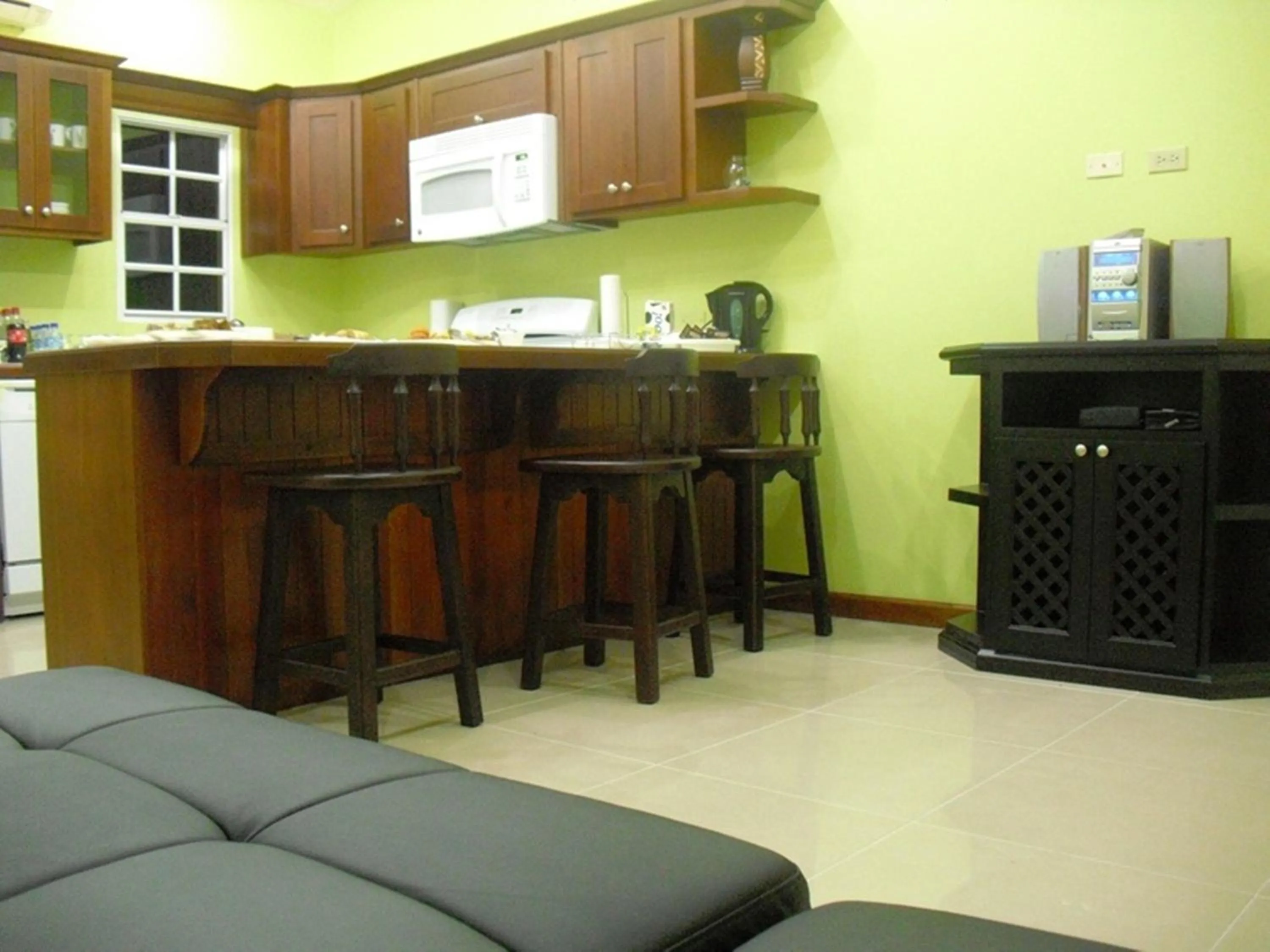 Kitchen or kitchenette in Piarco Village Suites