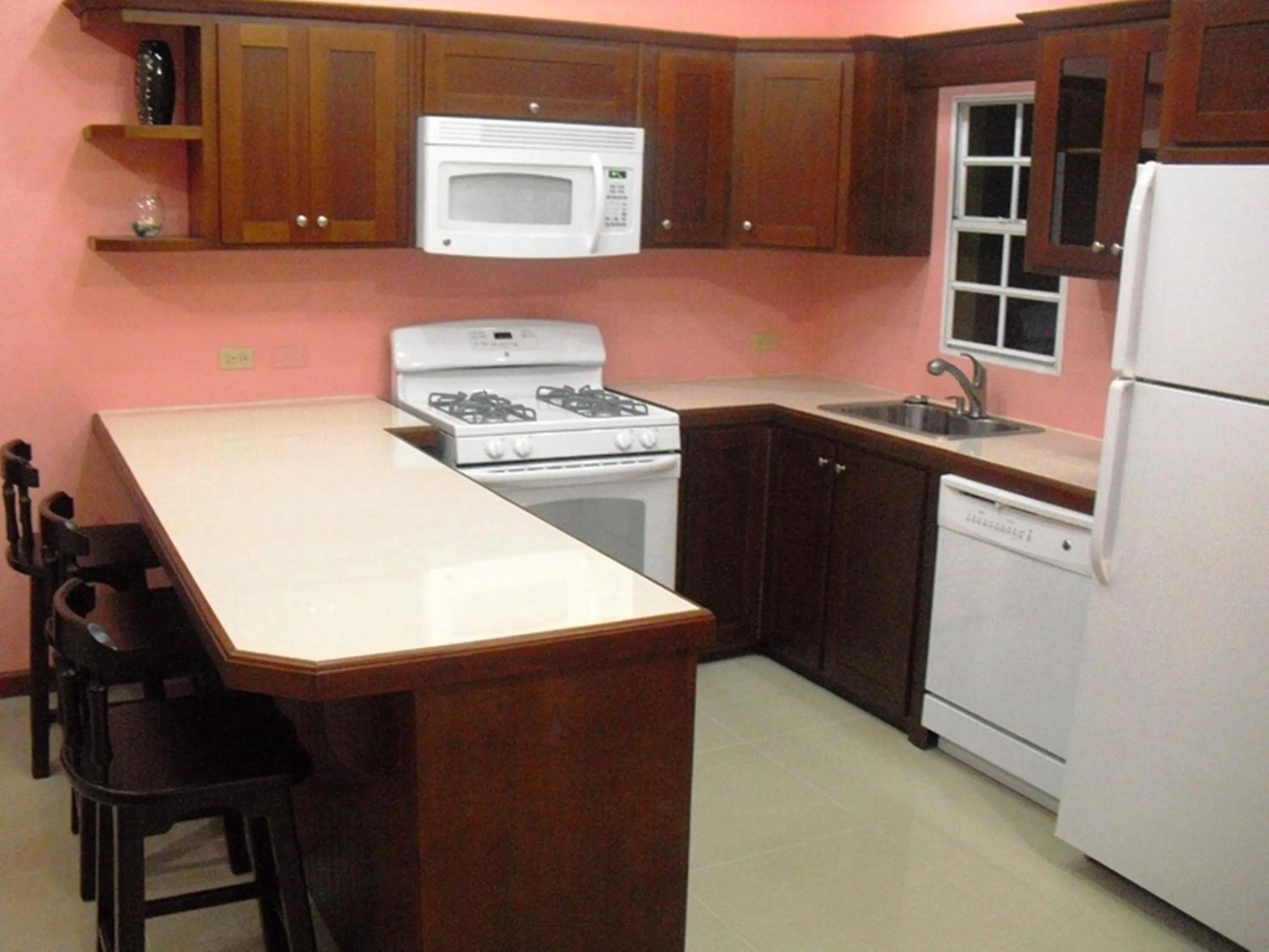 Kitchen or kitchenette in Piarco Village Suites
