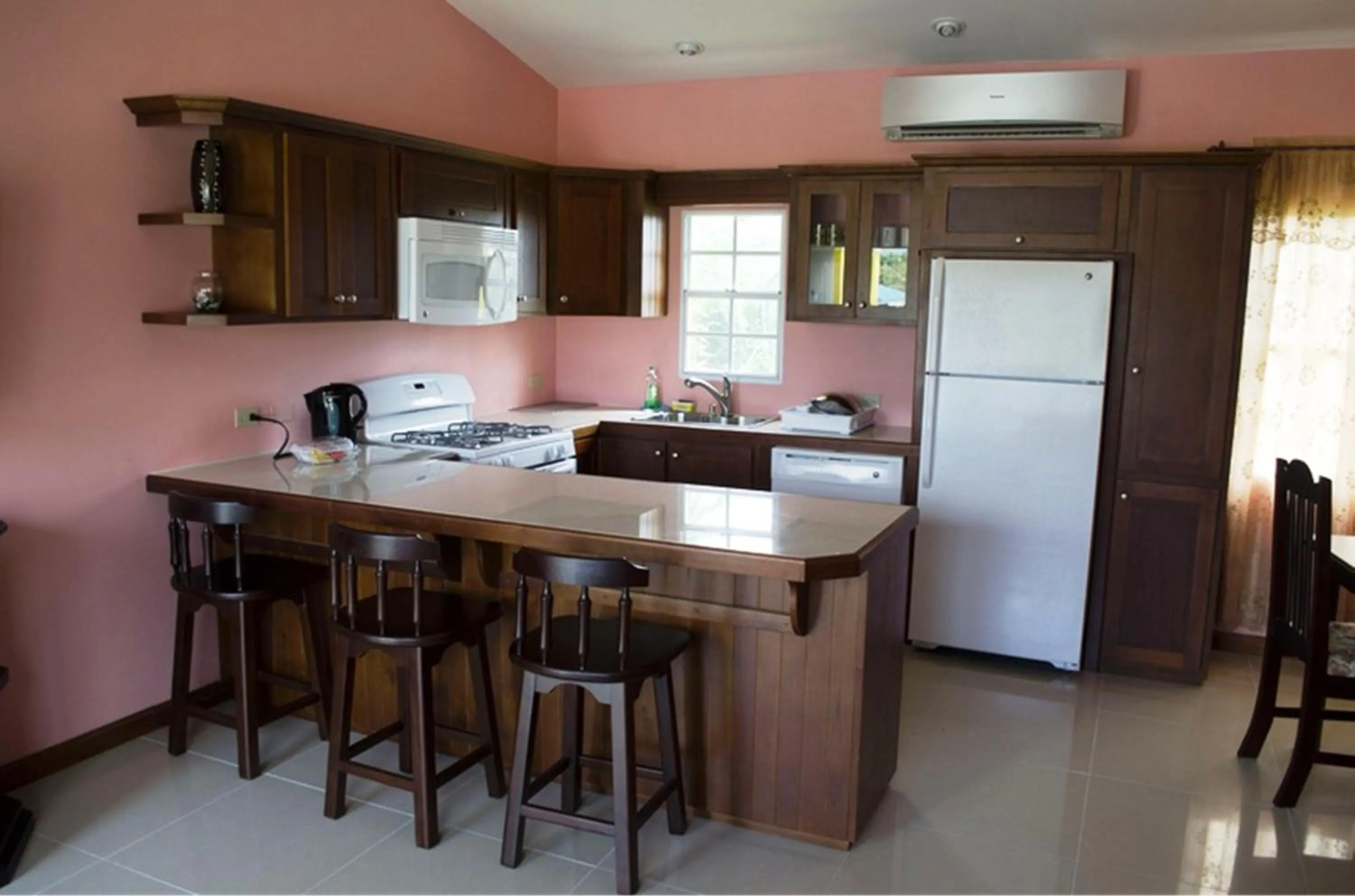 Kitchen or kitchenette in Piarco Village Suites