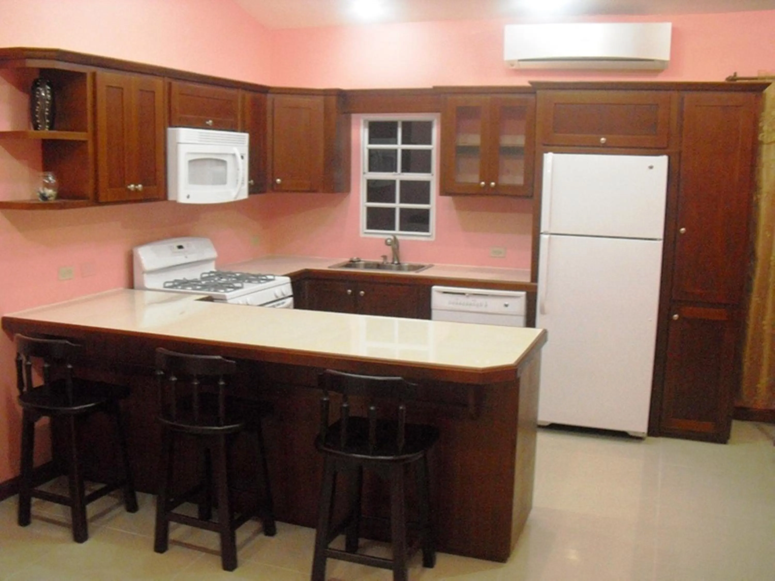 Kitchen or kitchenette in Piarco Village Suites