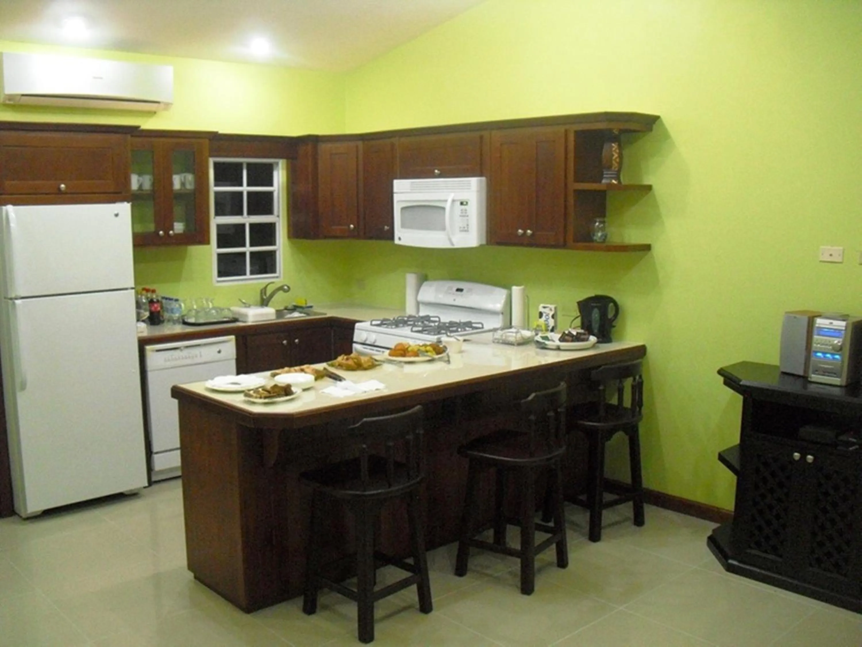 Kitchen or kitchenette in Piarco Village Suites