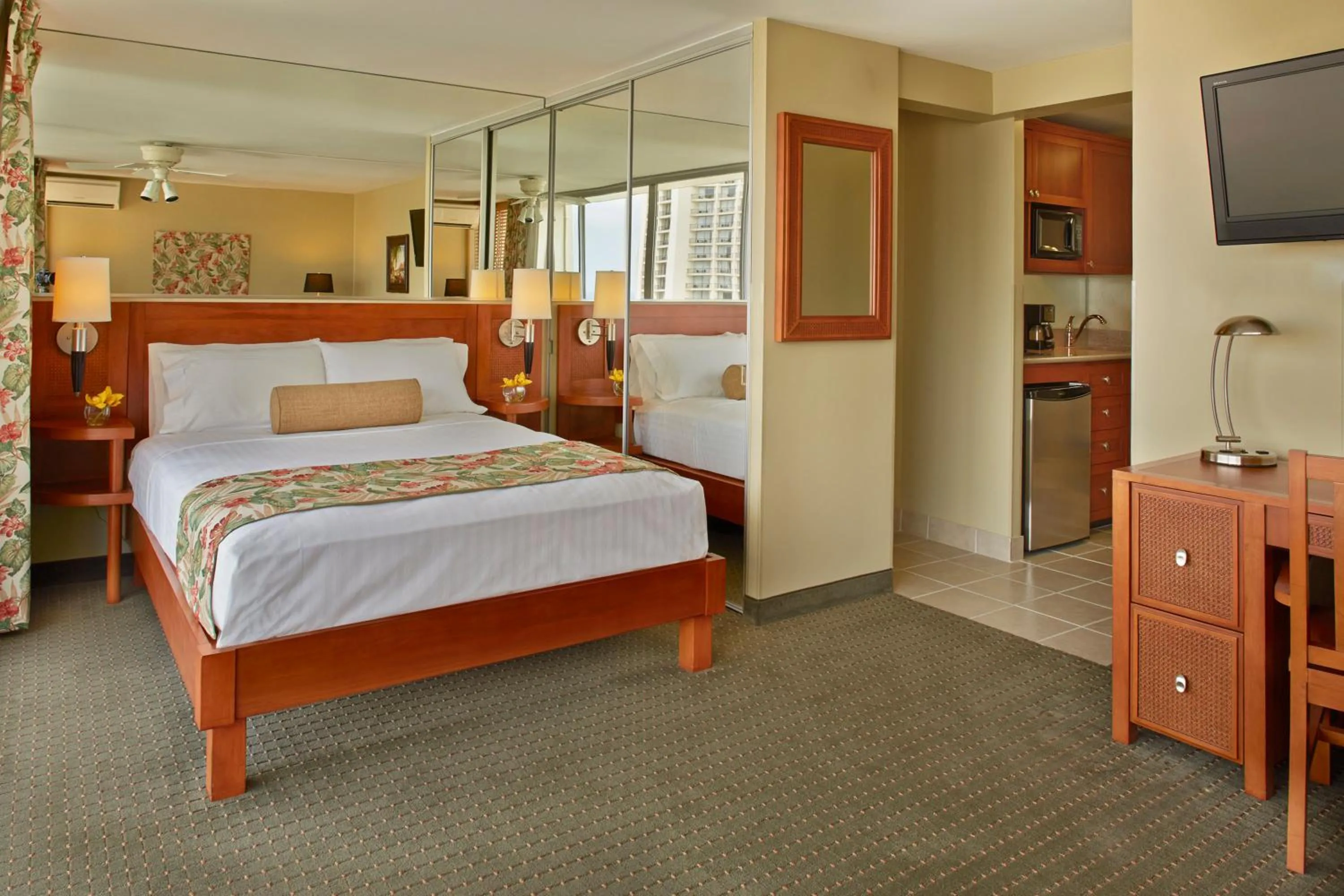 Bed in Pacific Monarch Hotel