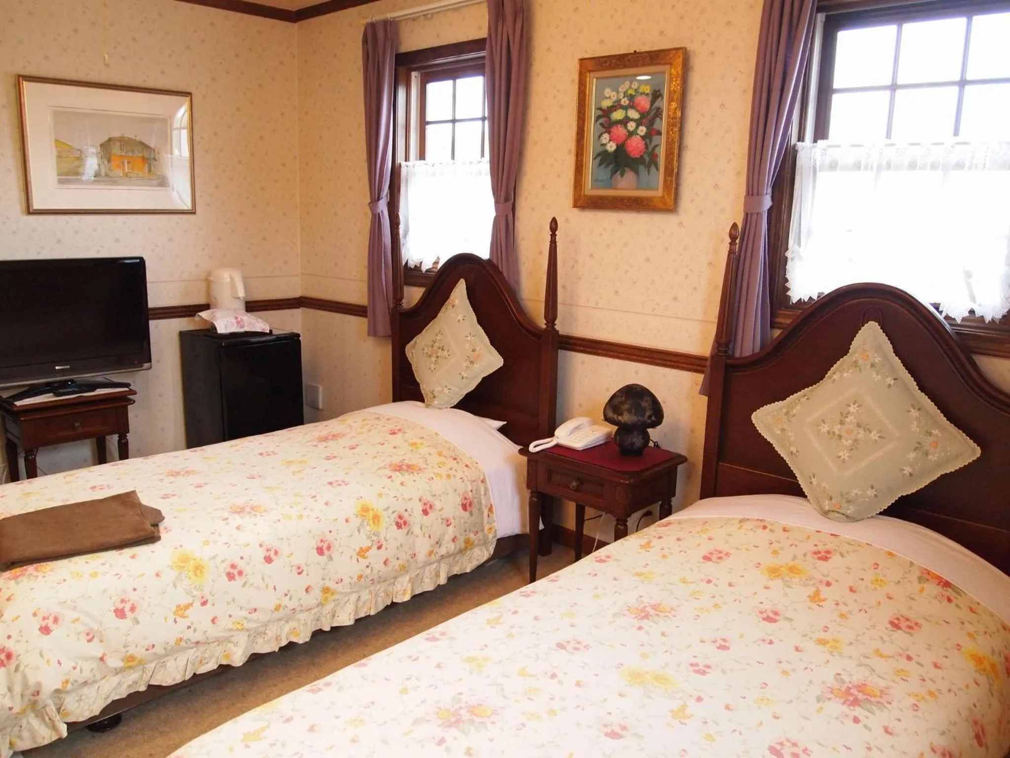 Bed in Petit Hotel Corinthian