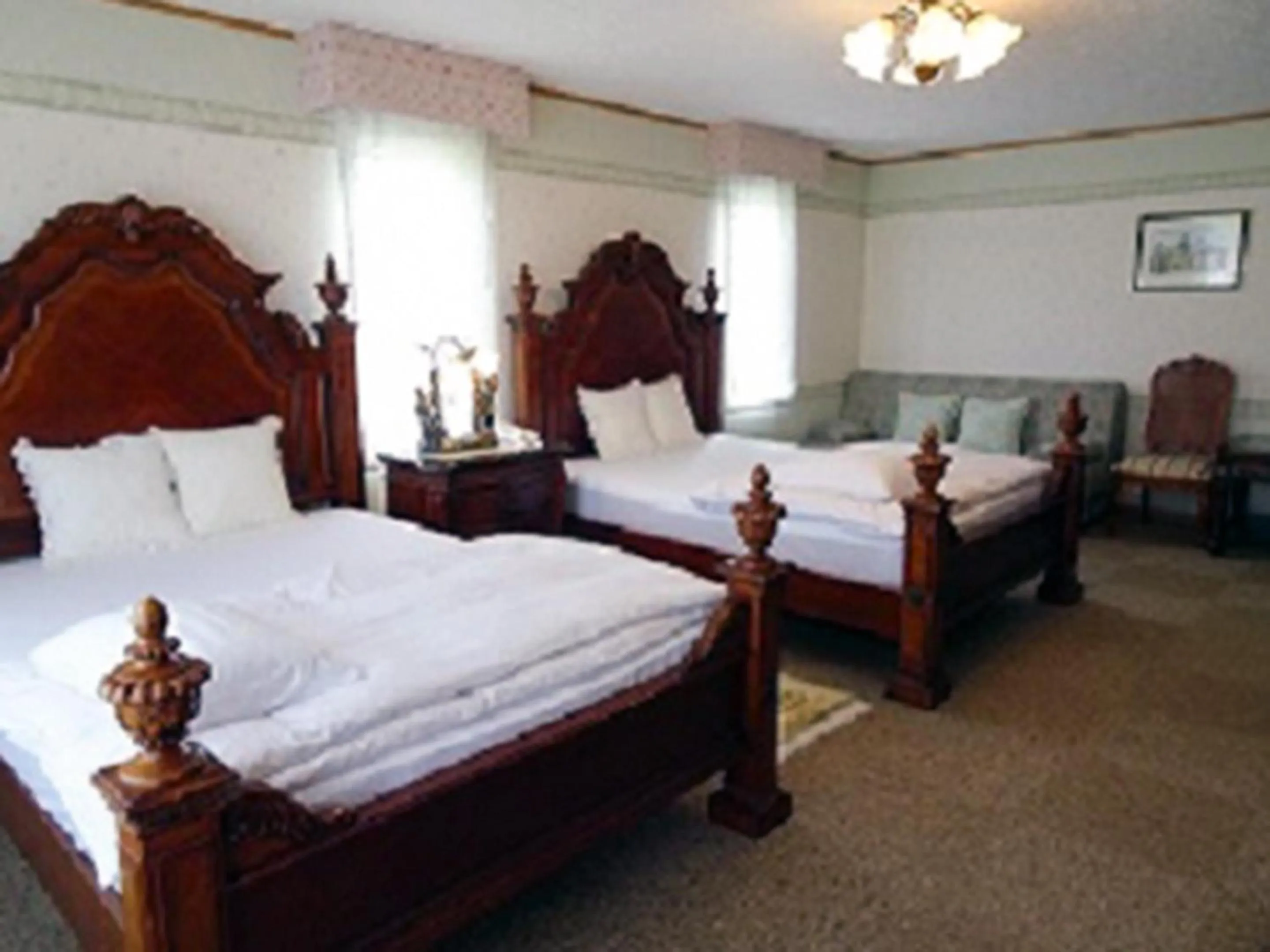 Bed in Petit Hotel Corinthian