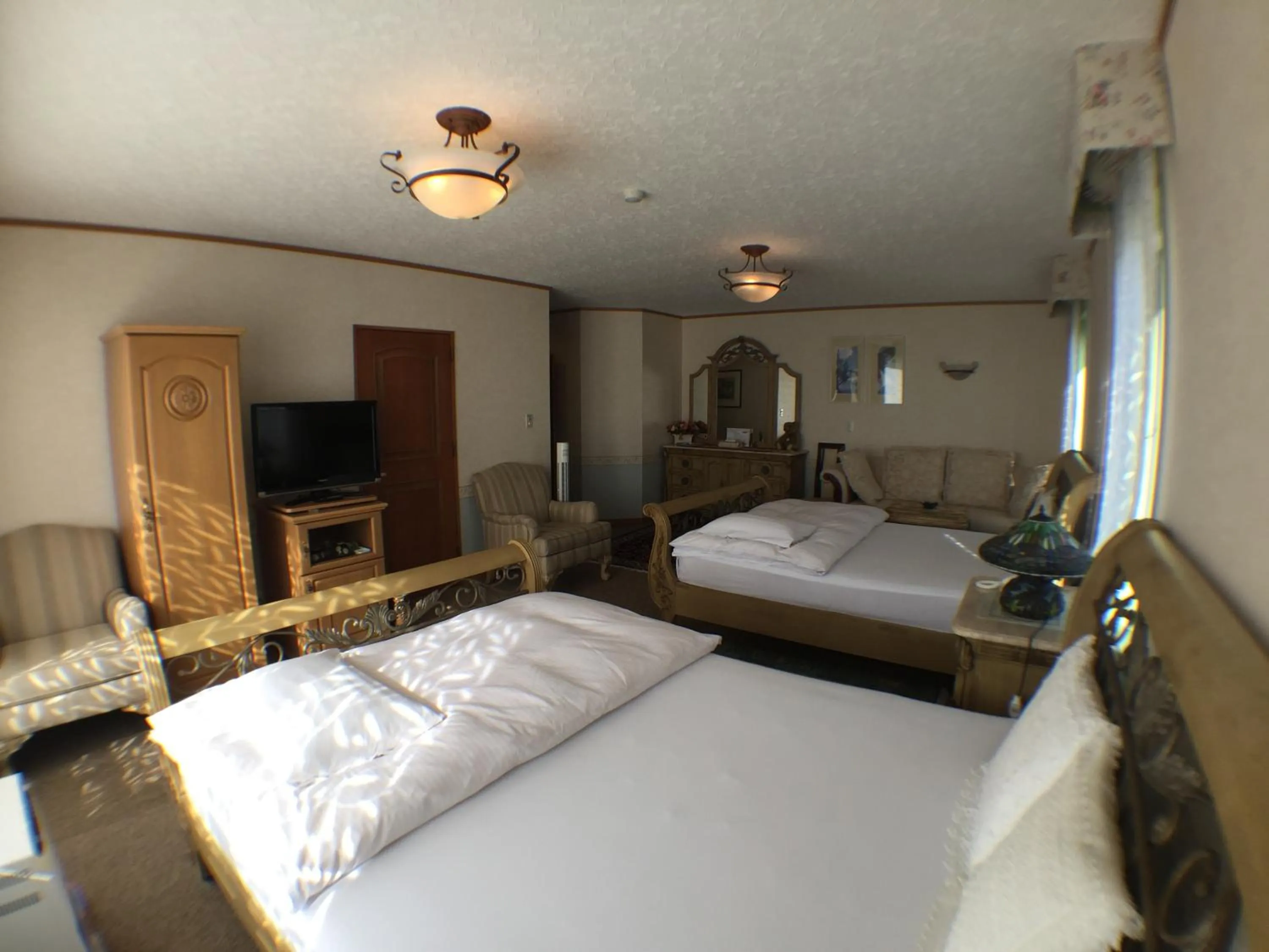 Bedroom in Petit Hotel Corinthian