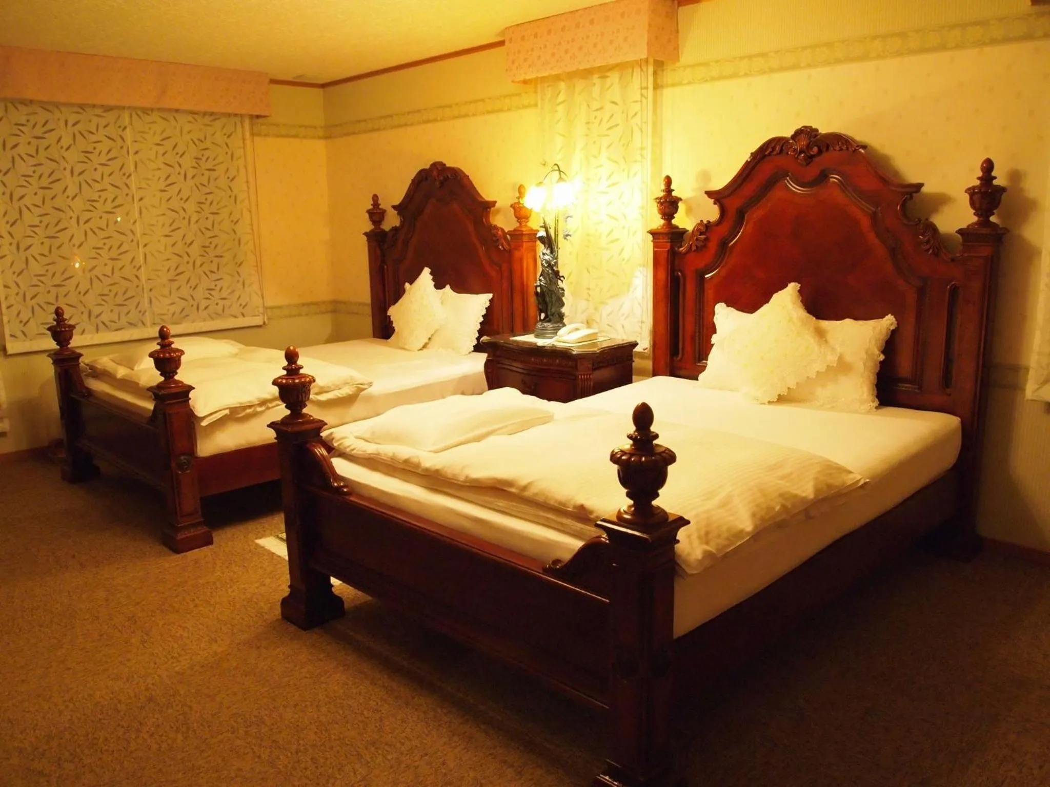 Bed in Petit Hotel Corinthian