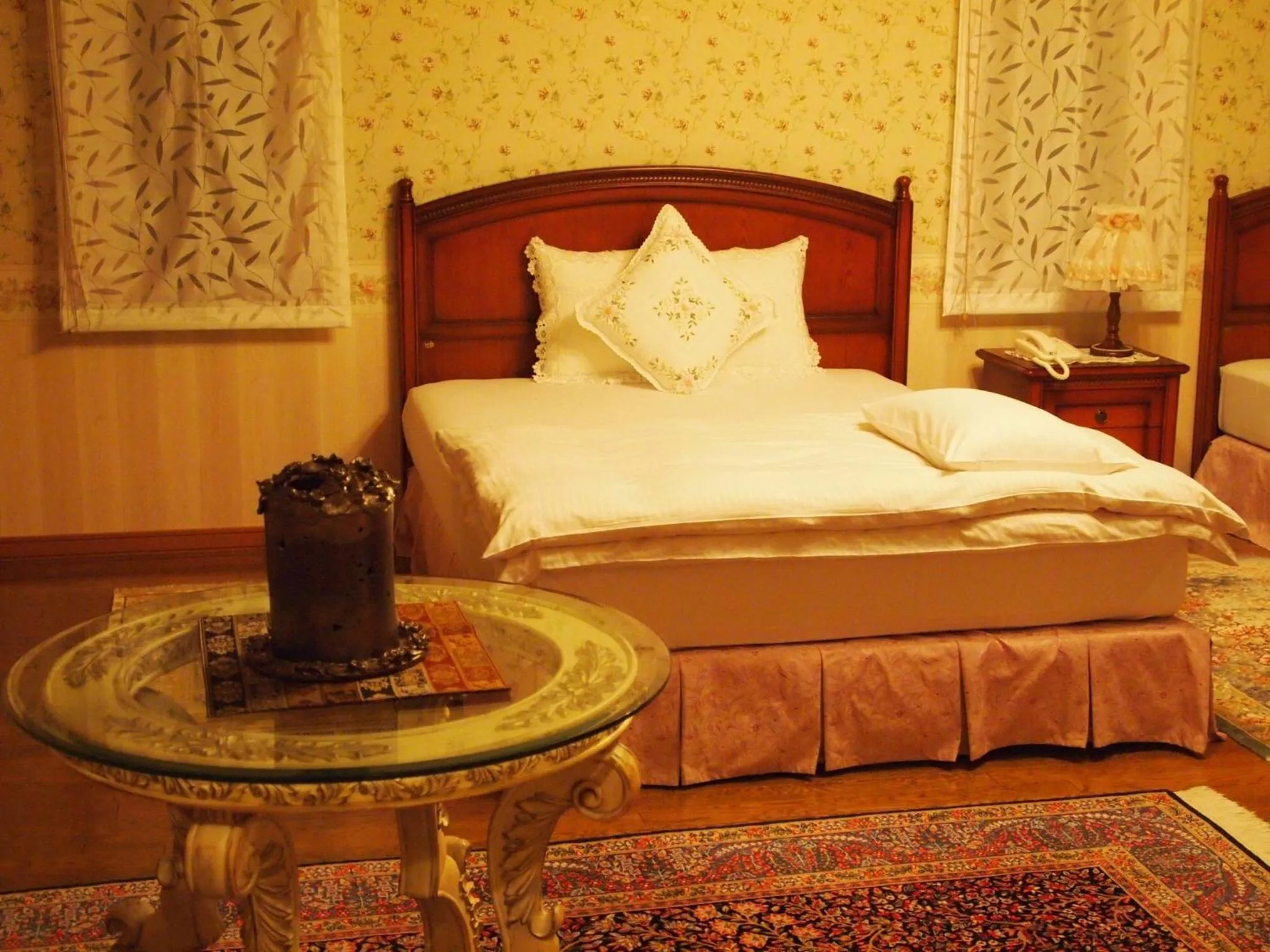 Bed in Petit Hotel Corinthian