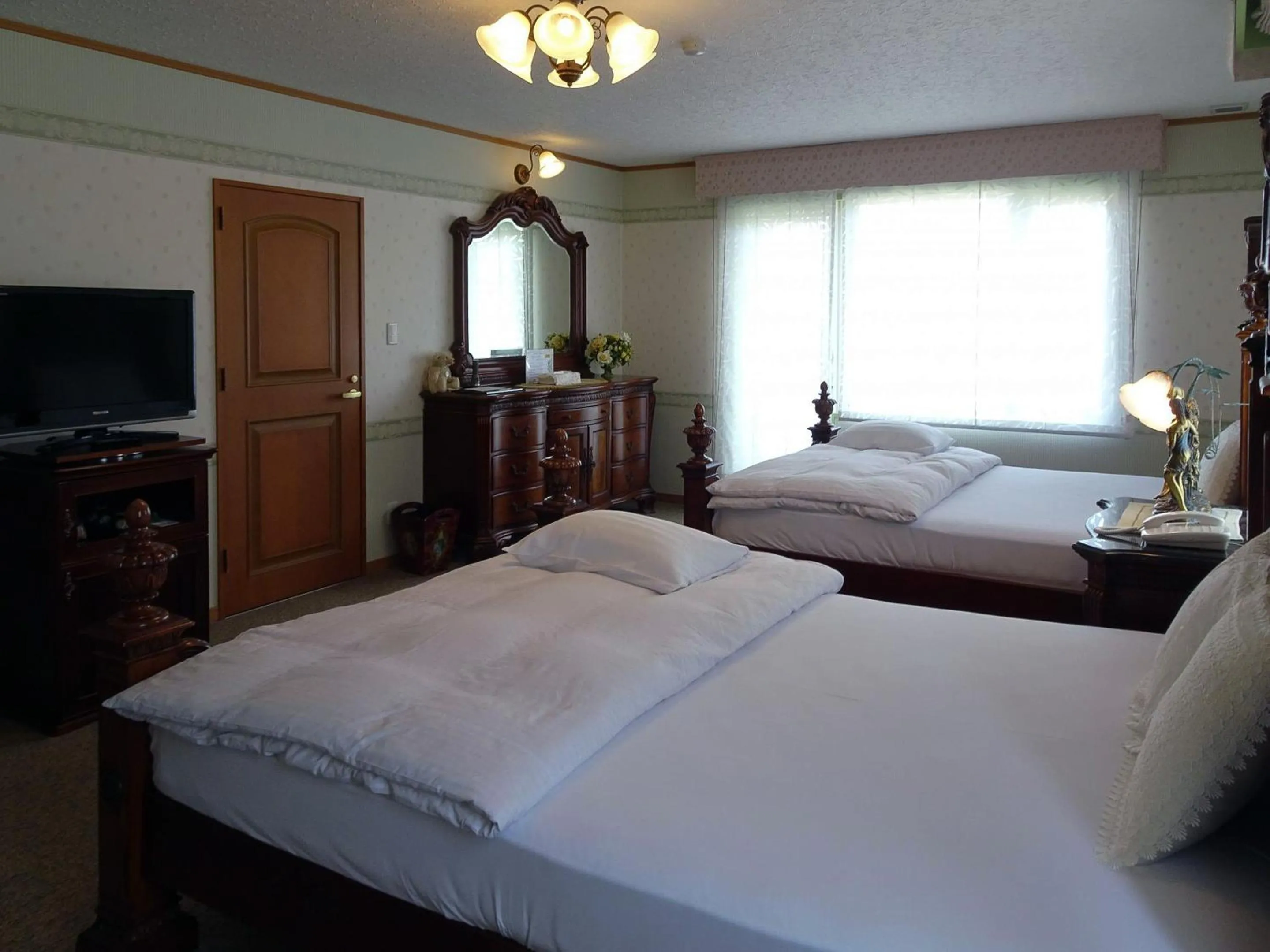 Bed in Petit Hotel Corinthian