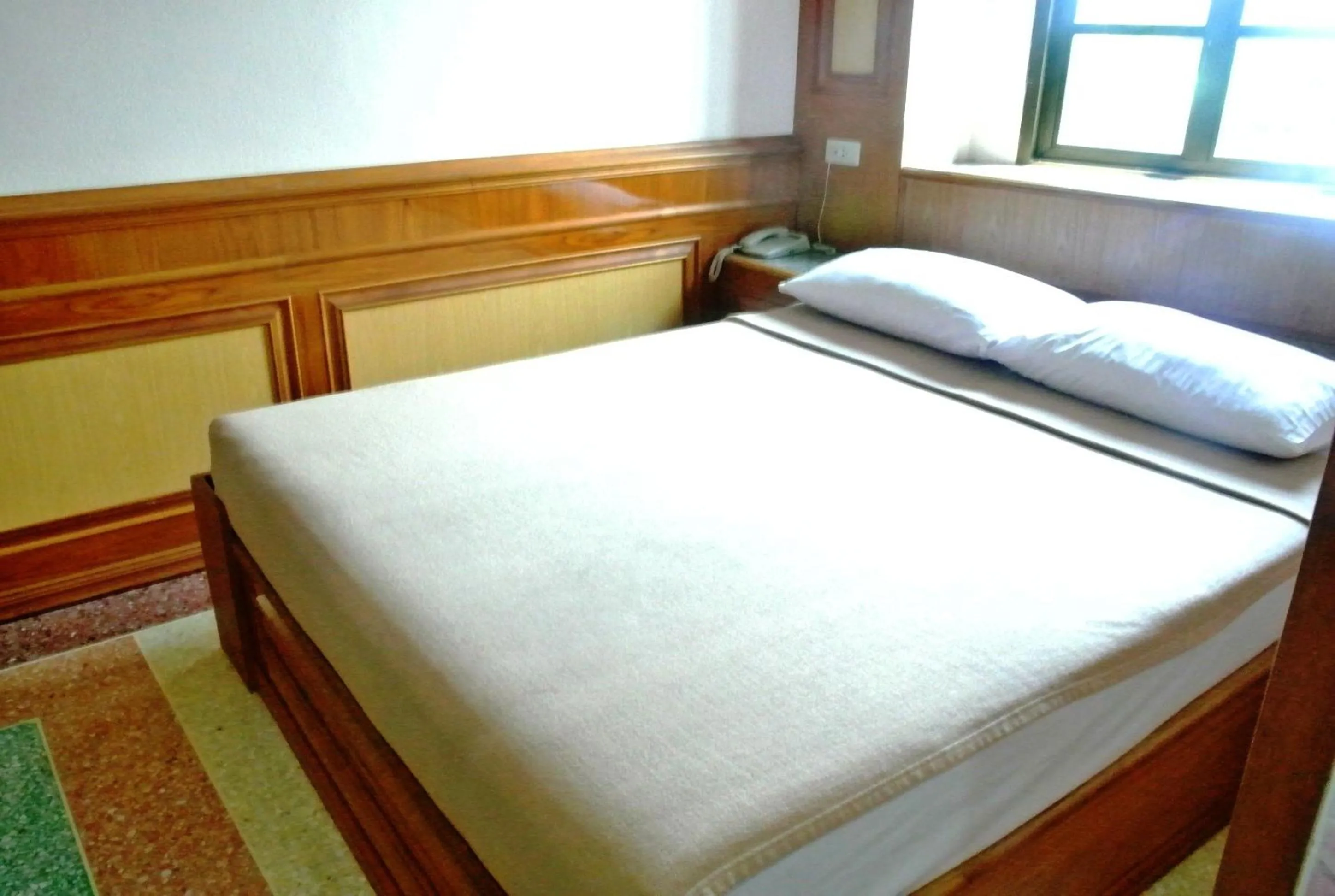 Bed in Rose Garden Hotel