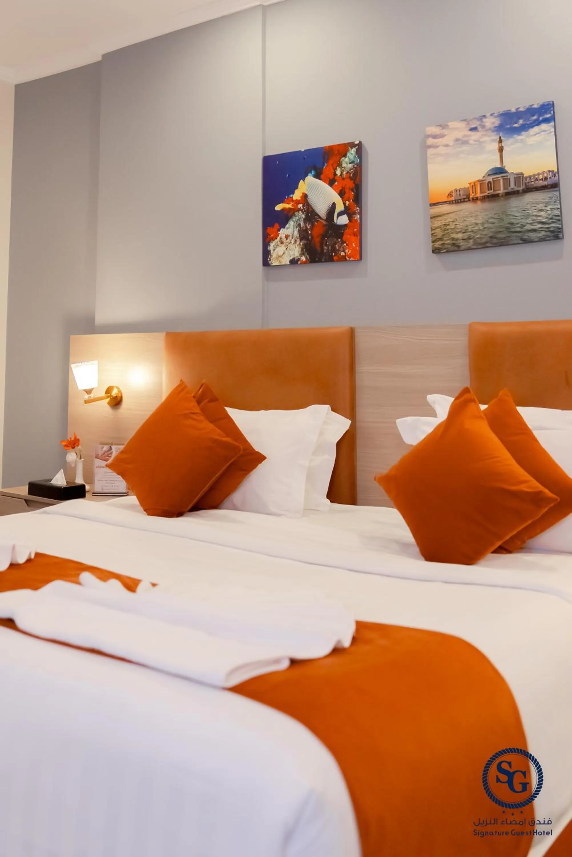 Bed in Signature Guest Hotel فندق إمضاء النزيل الفندقية