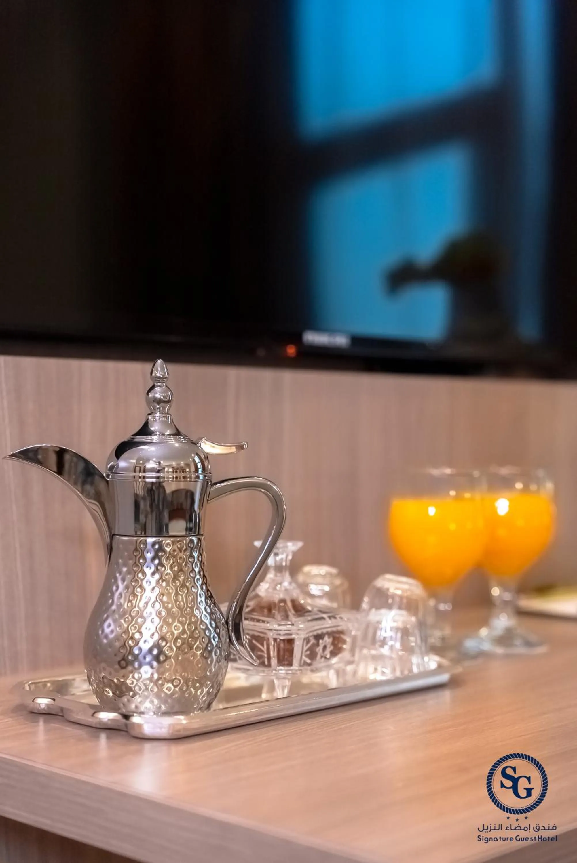 Drinks in Signature Guest Hotel فندق إمضاء النزيل الفندقية