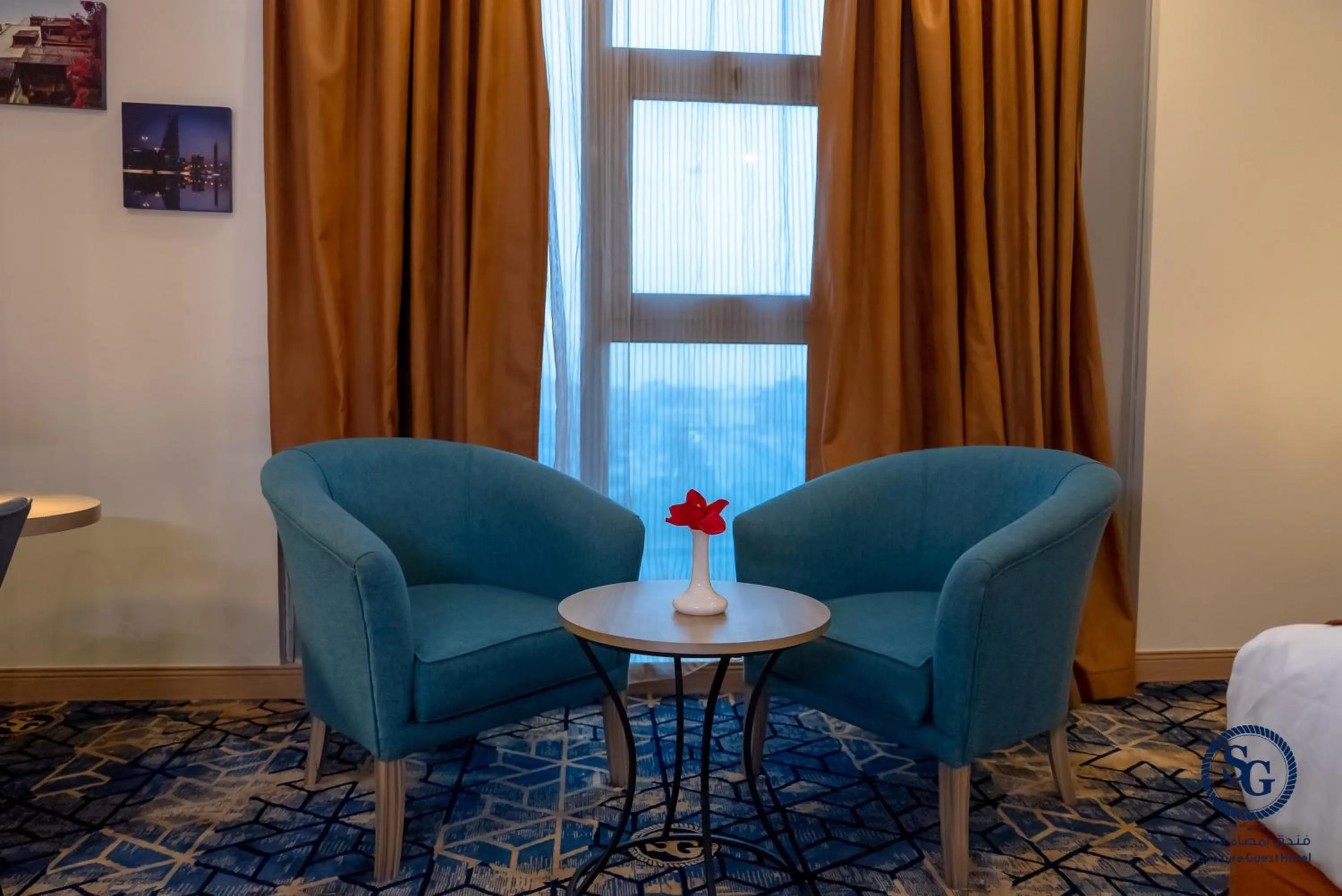 Seating area in Signature Guest Hotel فندق إمضاء النزيل الفندقية