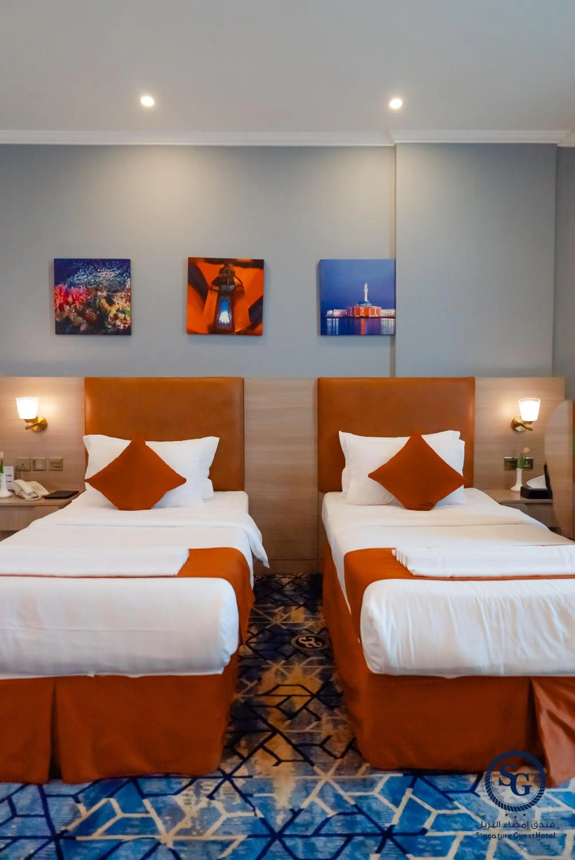 Bed in Signature Guest Hotel فندق إمضاء النزيل الفندقية